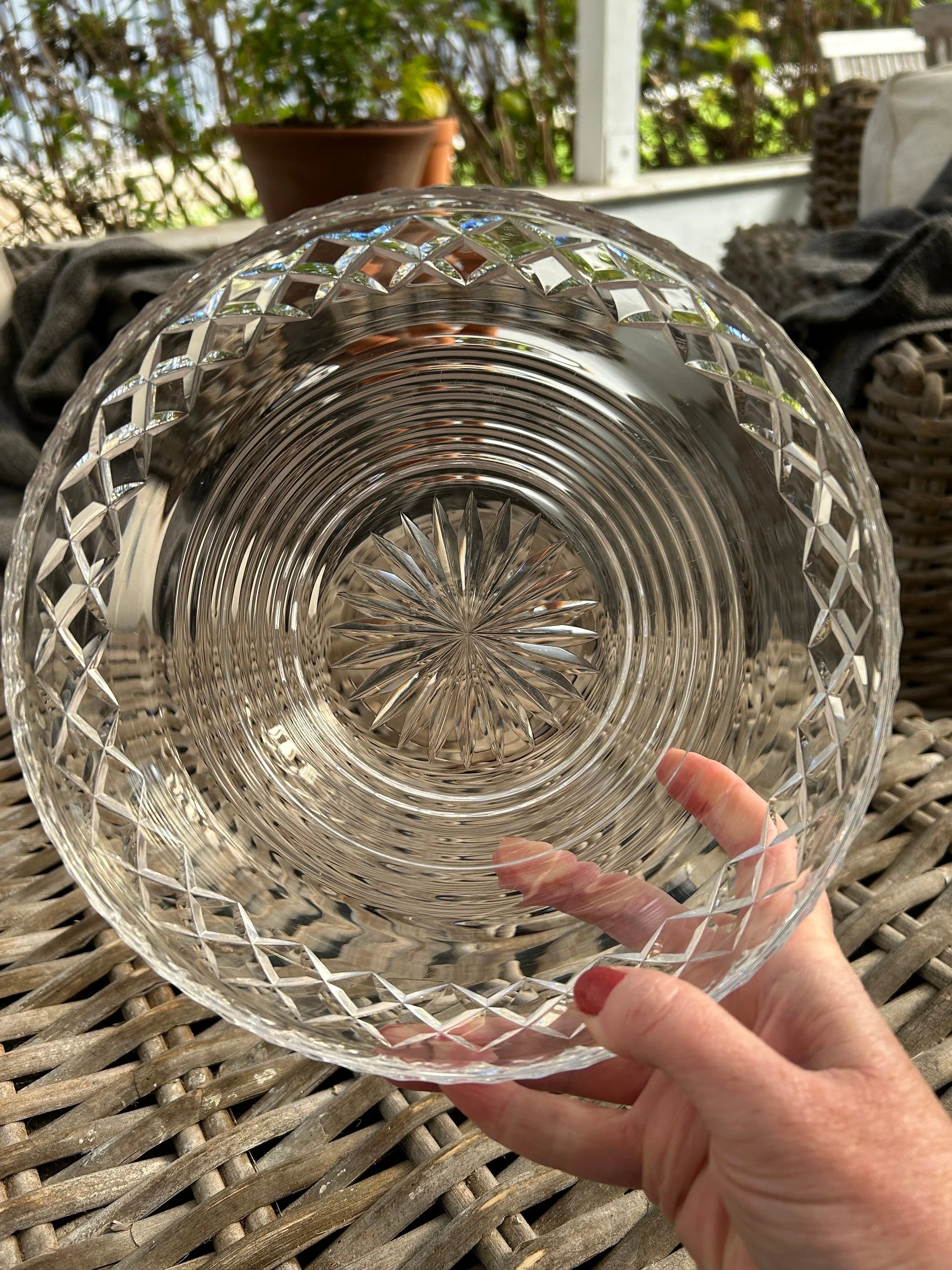 Interior view of crystal bowl showing circular ring pattern and central starburst motif