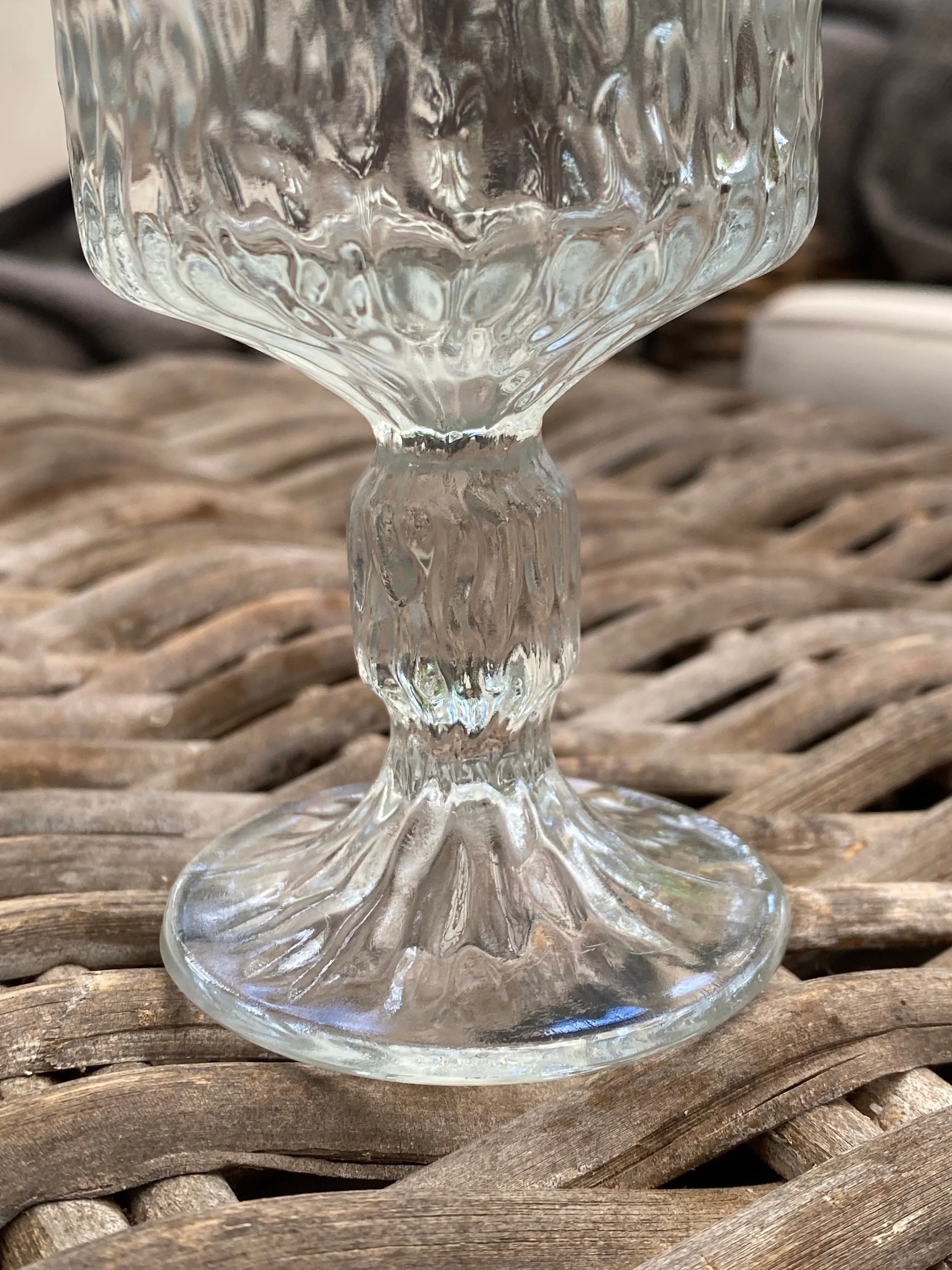 Detail of stem and bowl, highlighting textured glass and shape