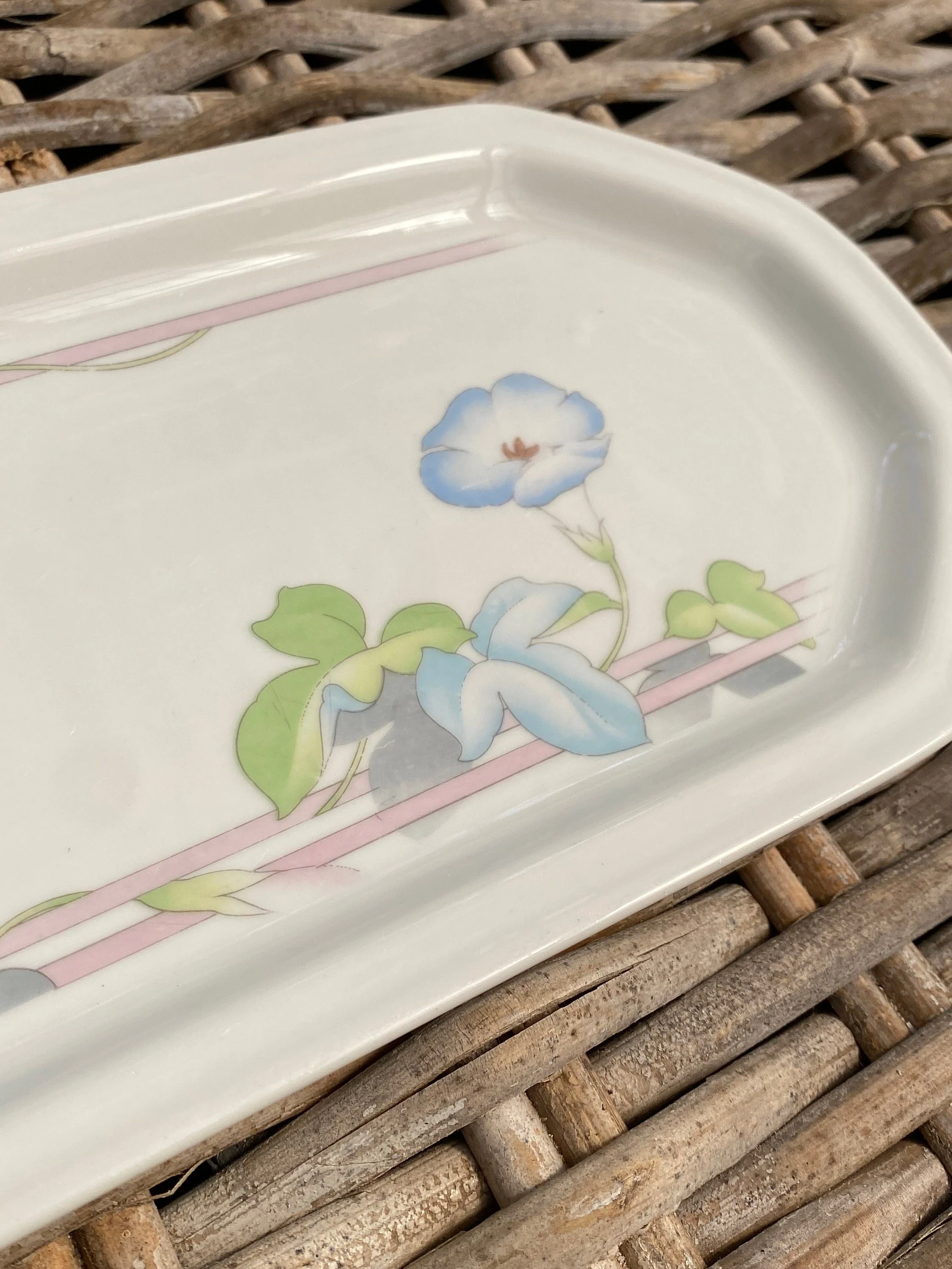 Close-up of the opposite end of the platter showing the floral design and glossy ceramic finish
