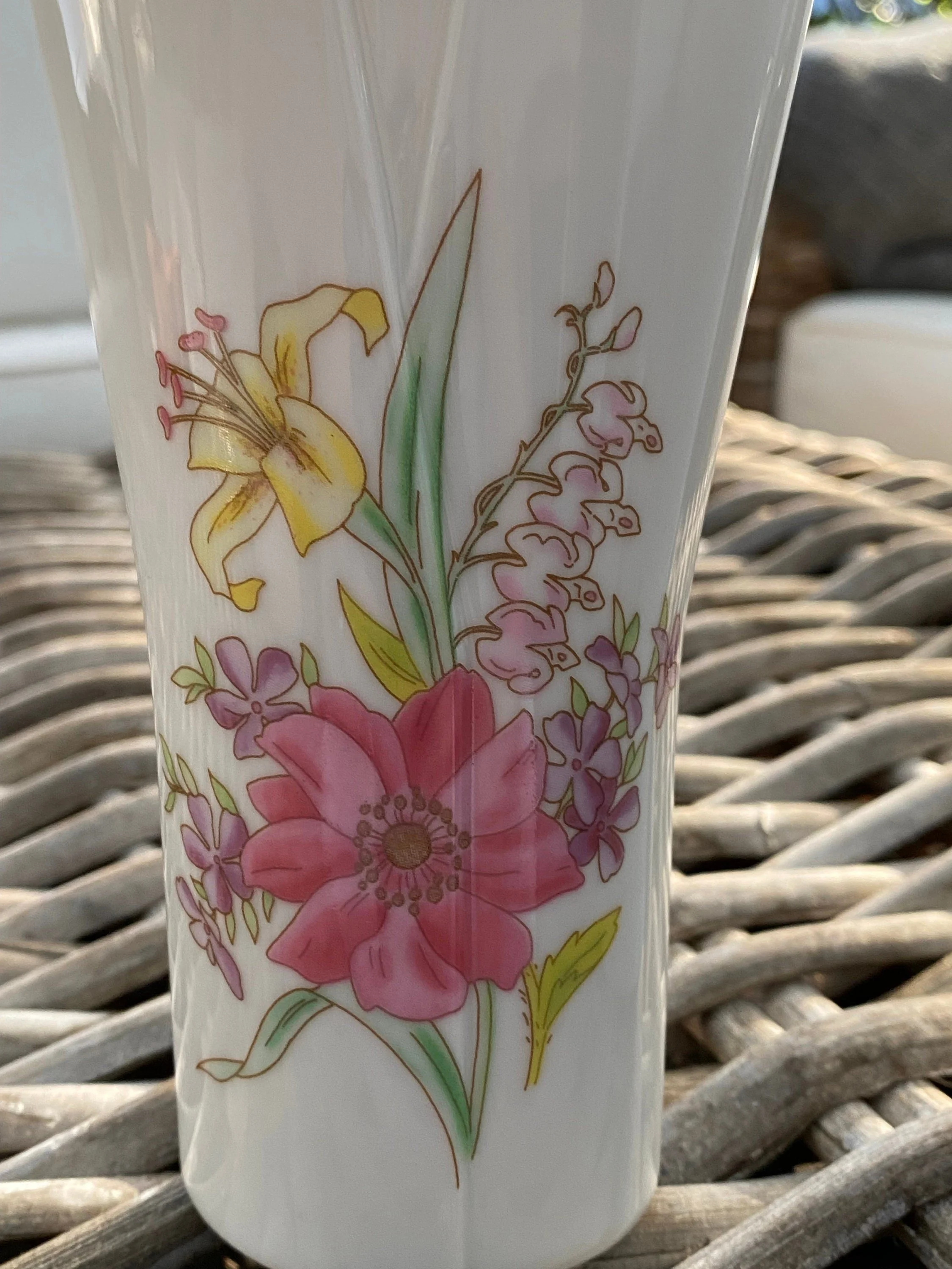 Close-up of floral motif – pink lilies, yellow daffodil, and greenery