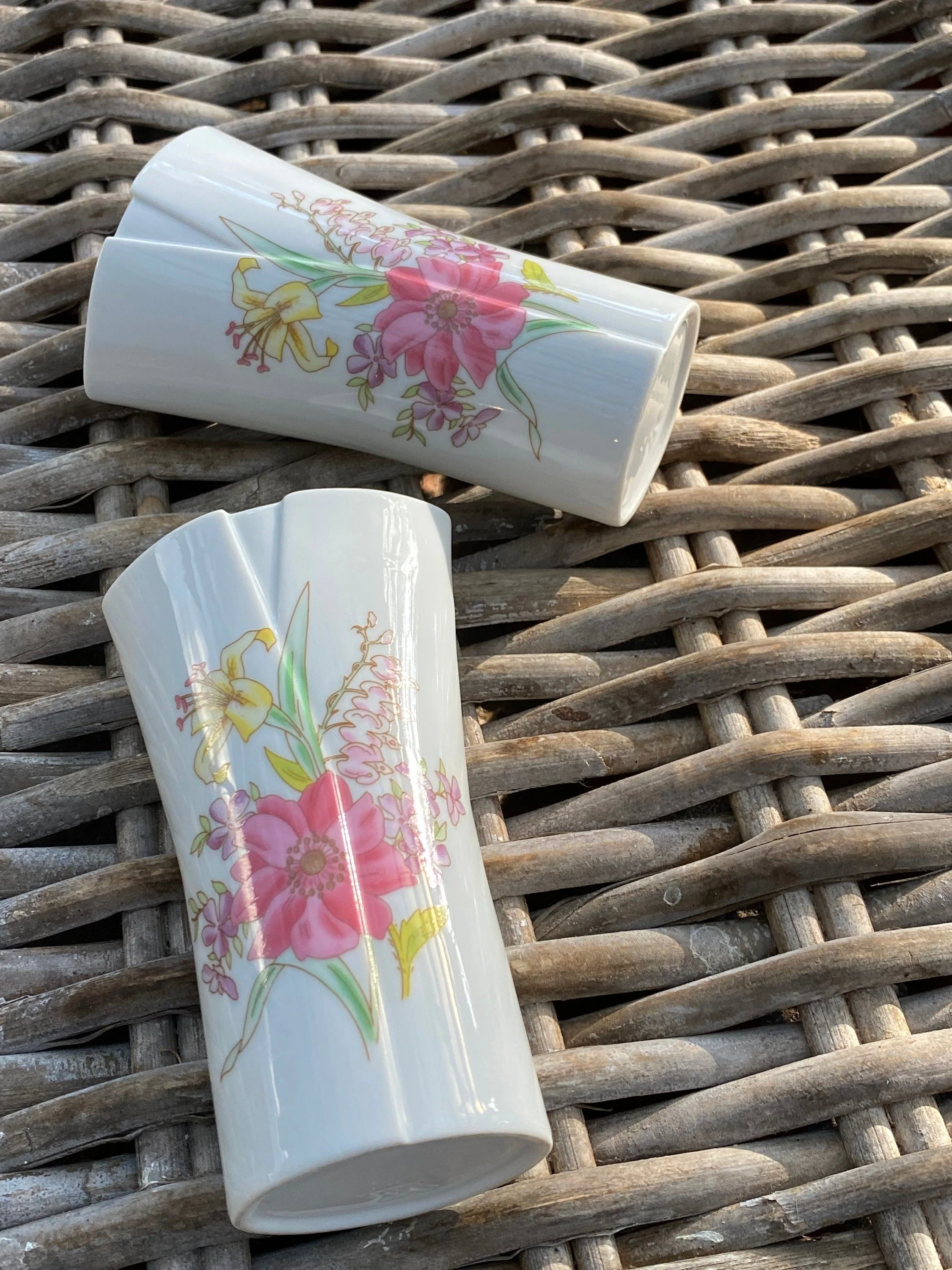 Vases lying down to show side floral detailing