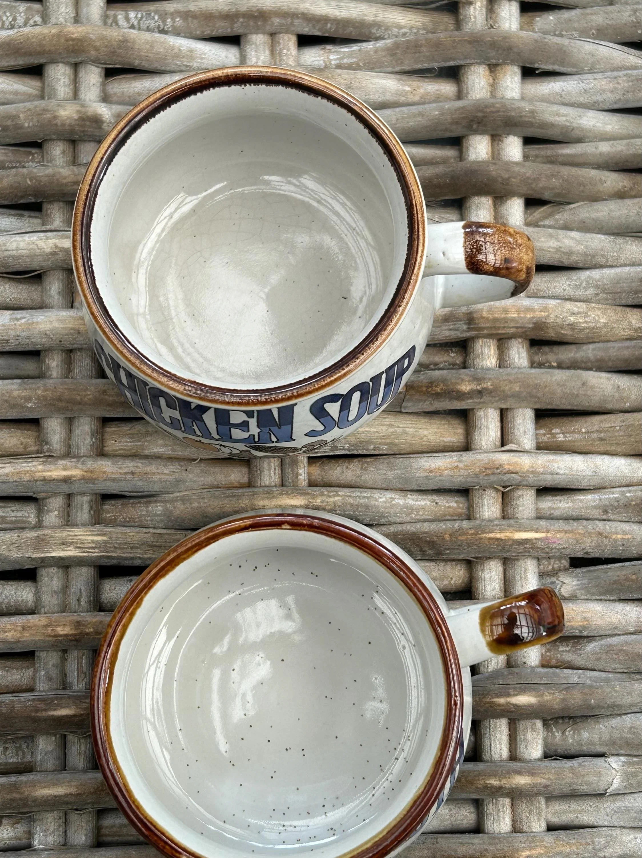 Top-down view of both mugs showing clean interiors and brown rims