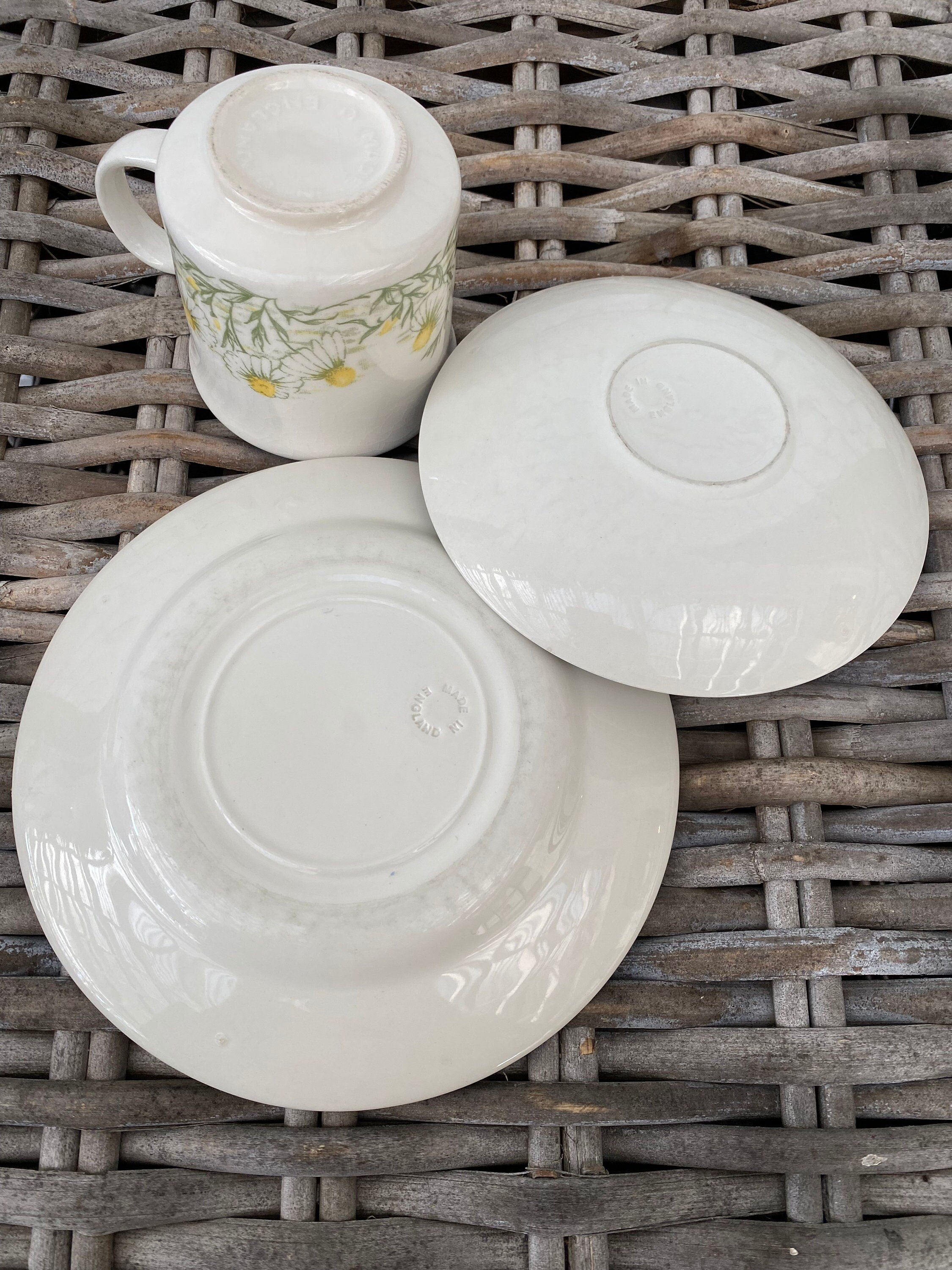 Underside of Churchill tea set showing embossed maker’s marks on cup, saucer, and plate
