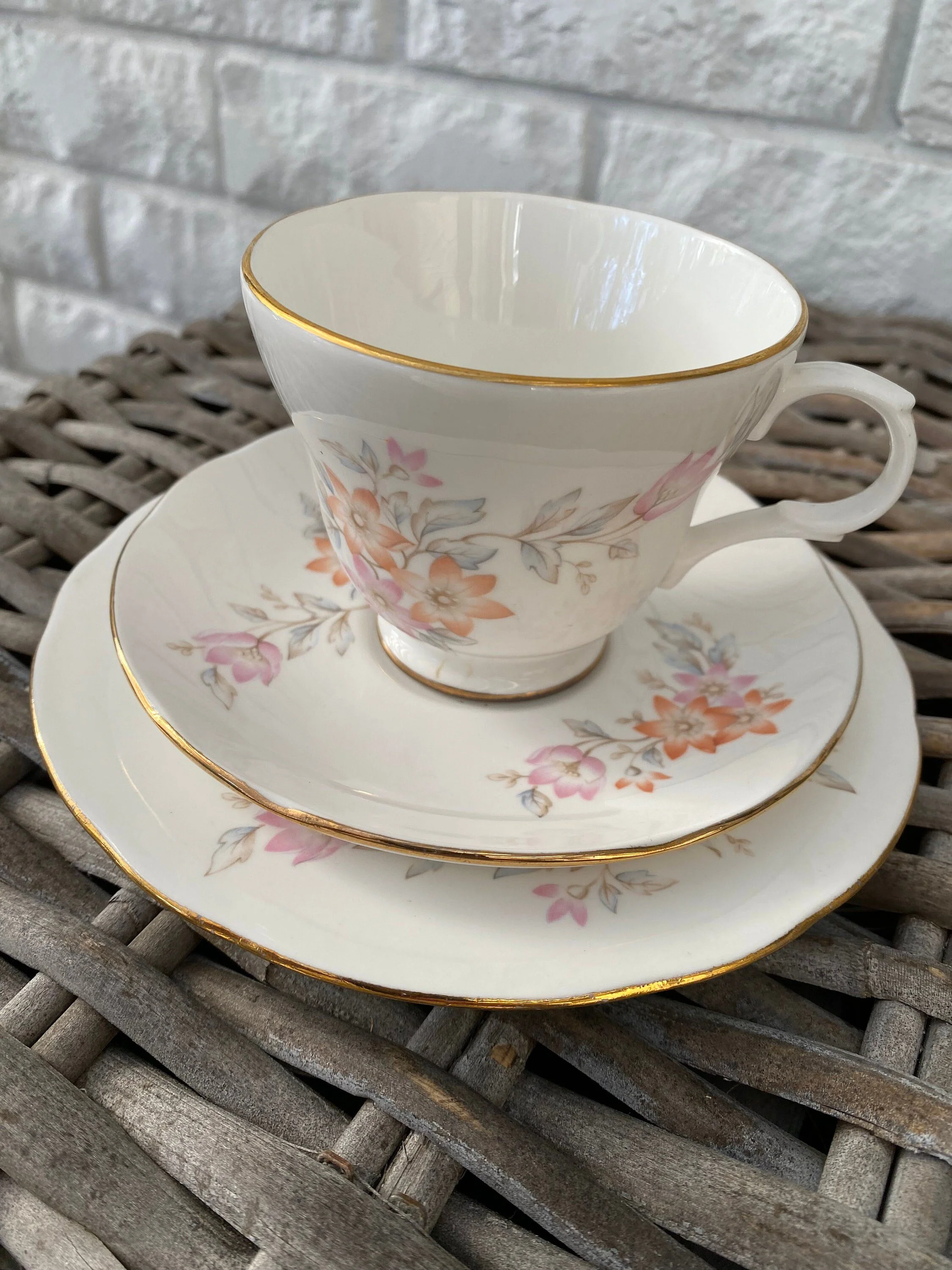 Close-up of the trio showing delicate floral patterns and gold rim
