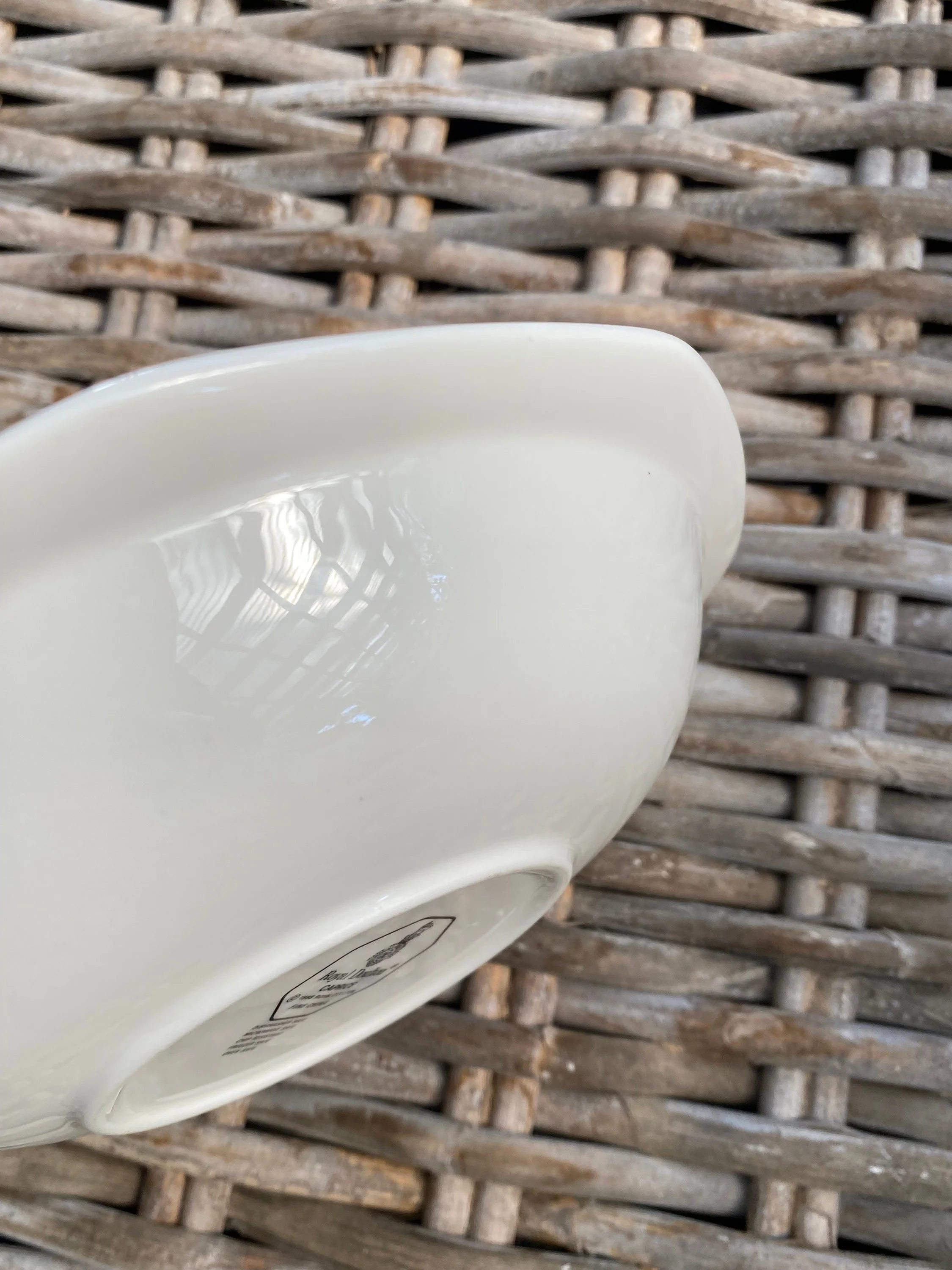 Detail of gently curved porcelain lip and clean glaze