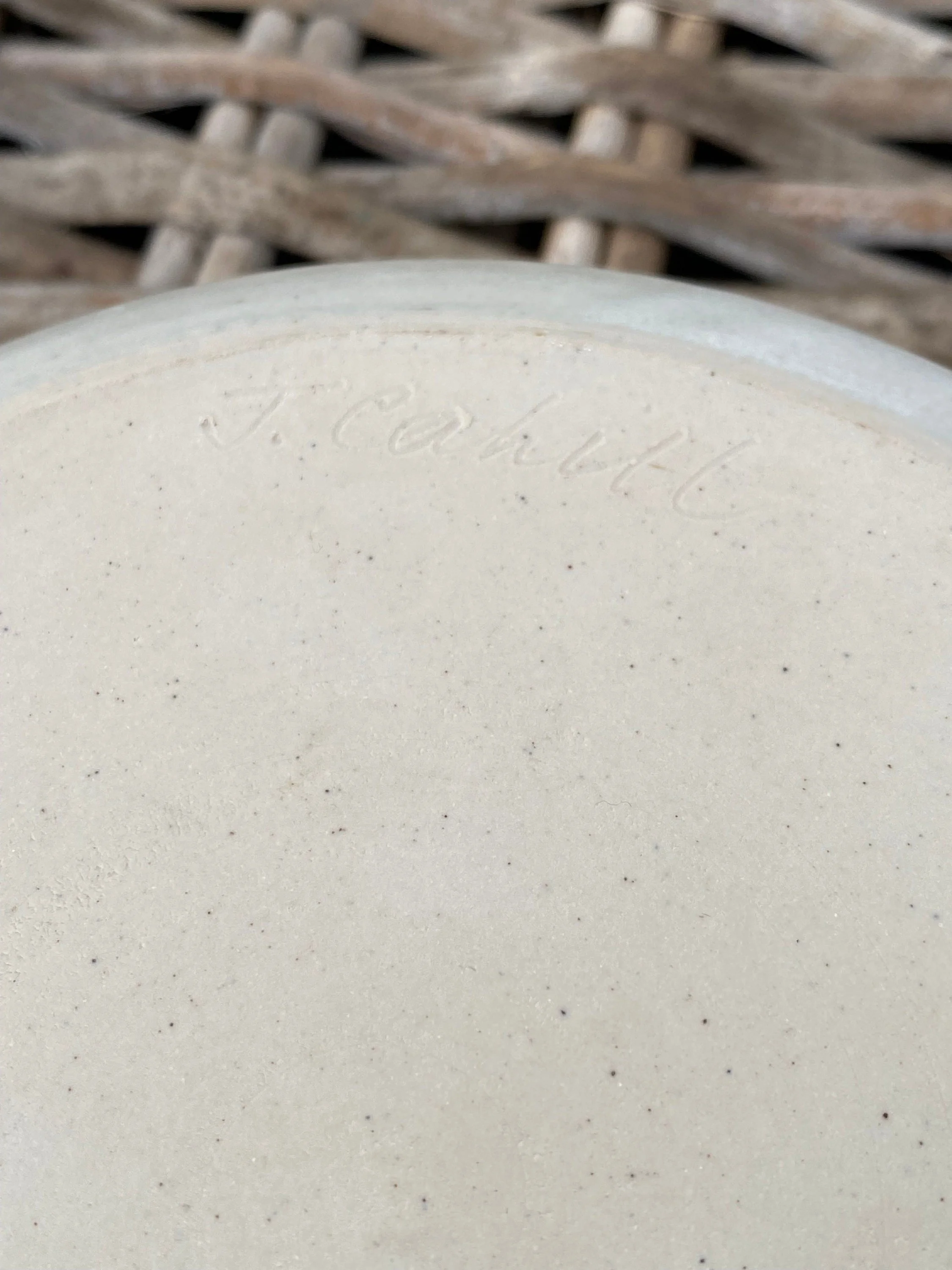 Close-up of signature "J. Cahill" inscribed into the base