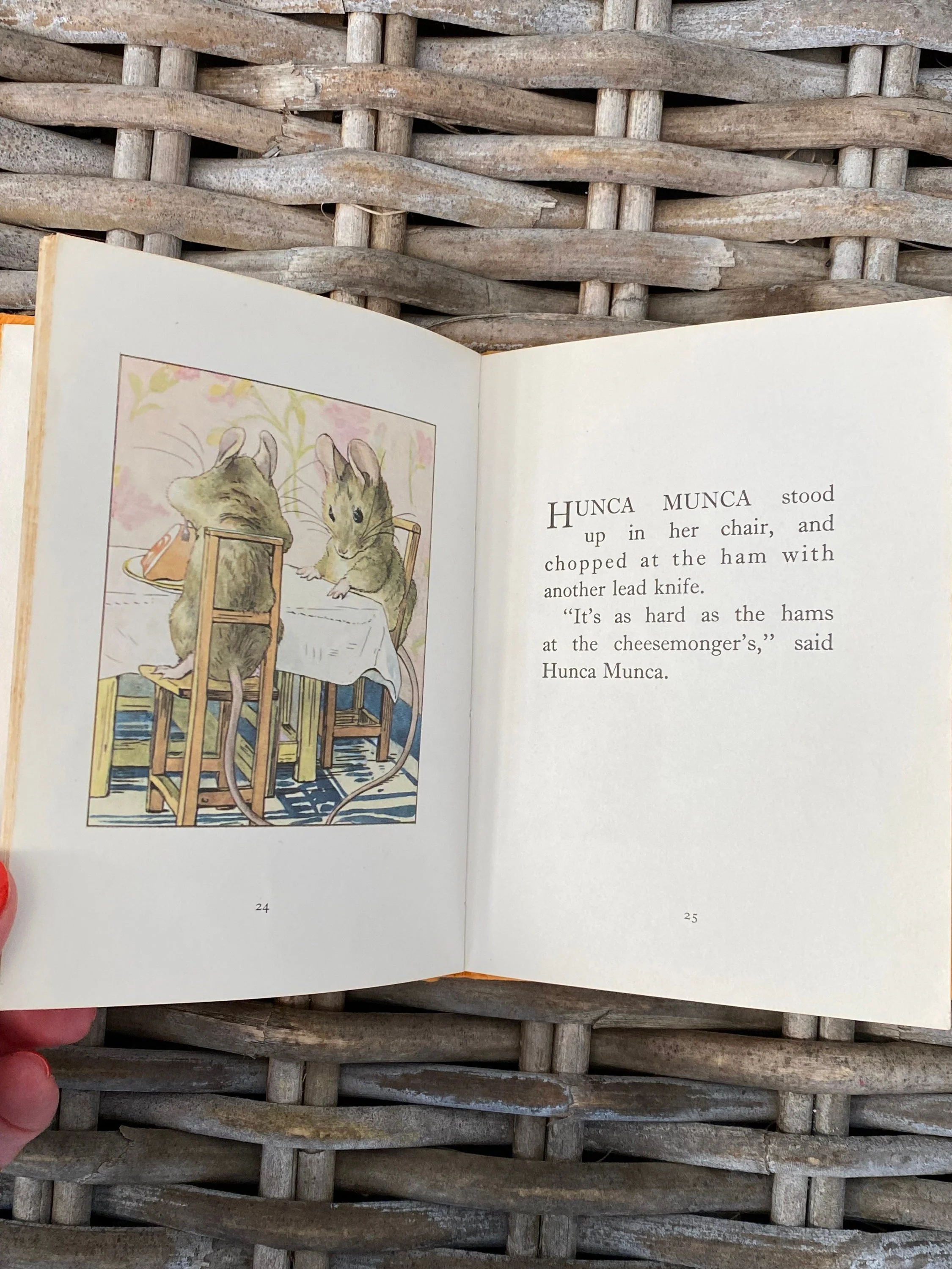 Close-up of two mice cutting food at the dollhouse table