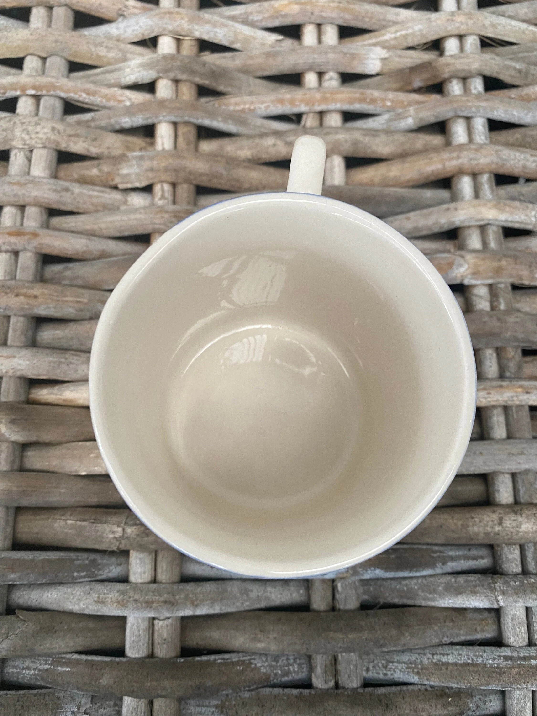 Top view of stoneware mug showing cream glazed interior