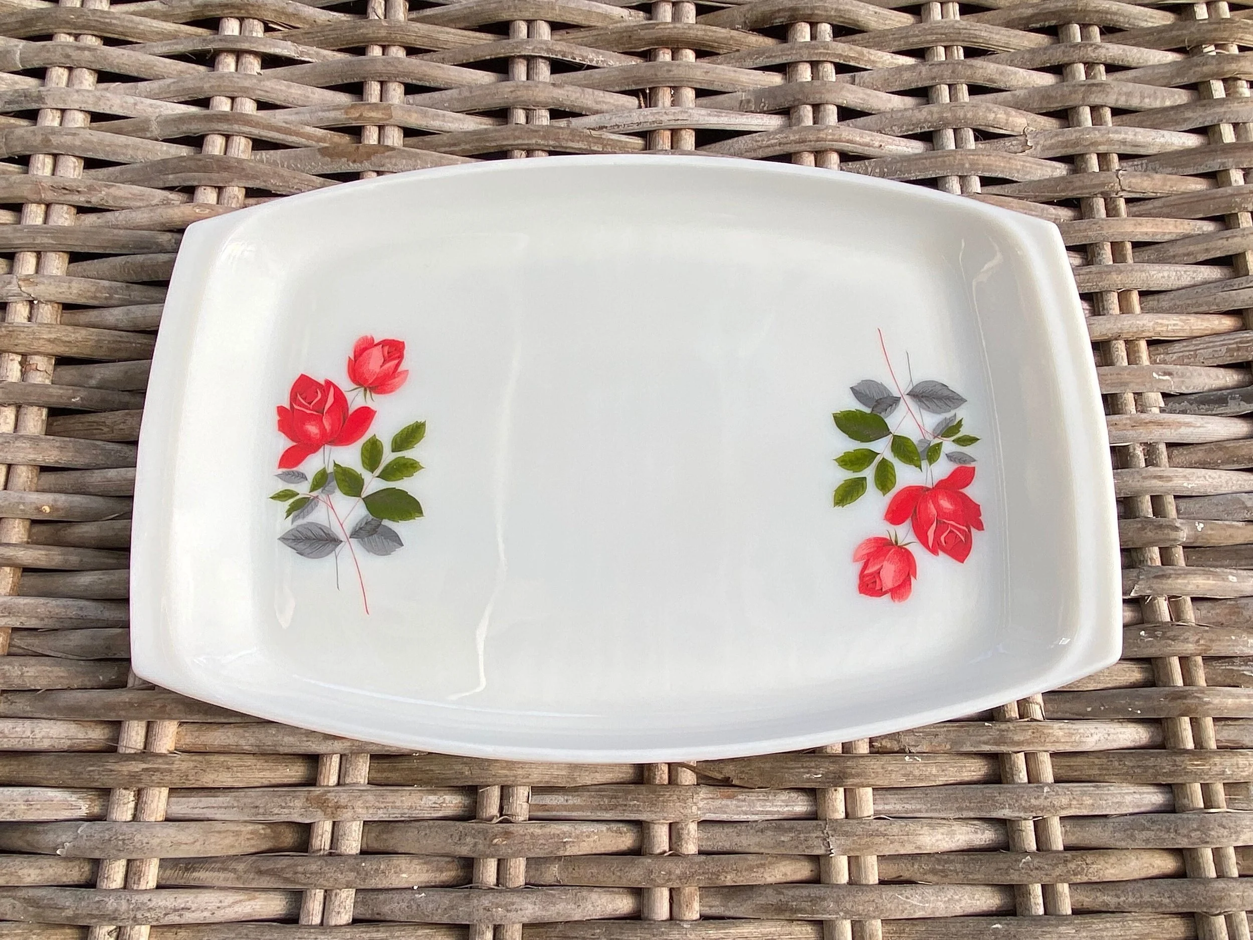 Top-down view of full tray showing both rose motifs