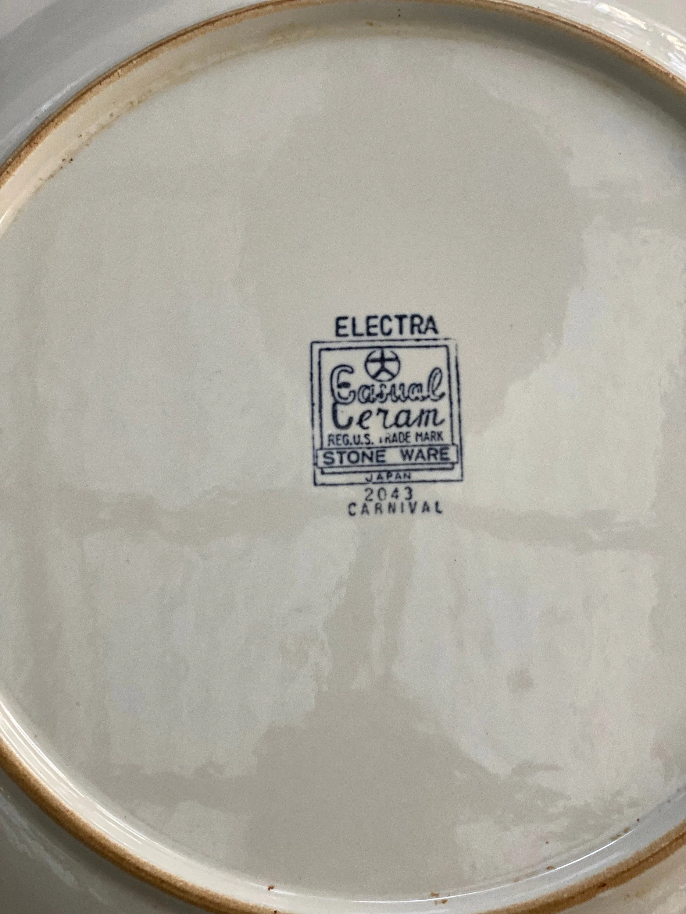 Brand stamp on back reading "Electra Stone Ware Carnival 2043"