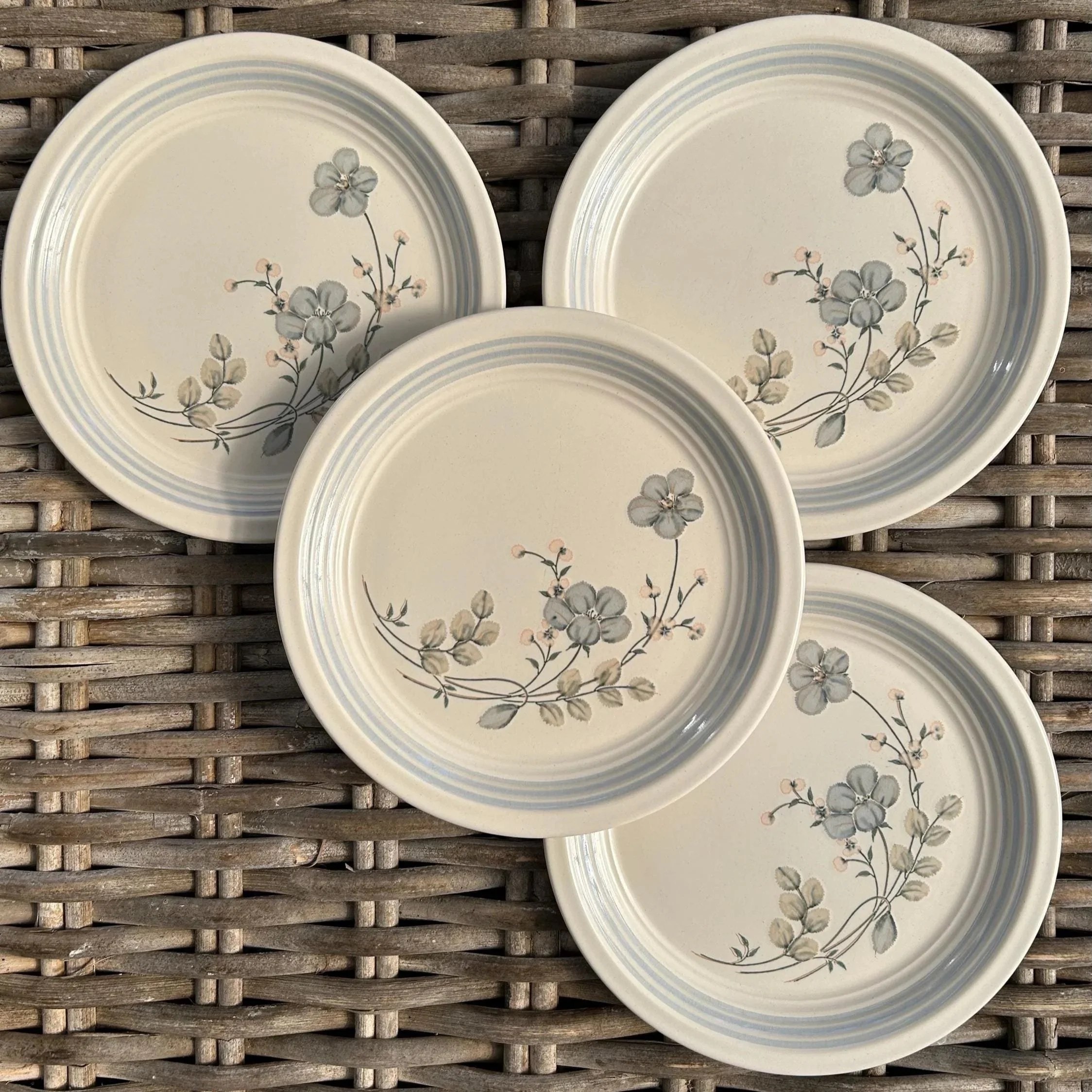 Top-down of 4 Misty Morn side plates showing floral motif on each