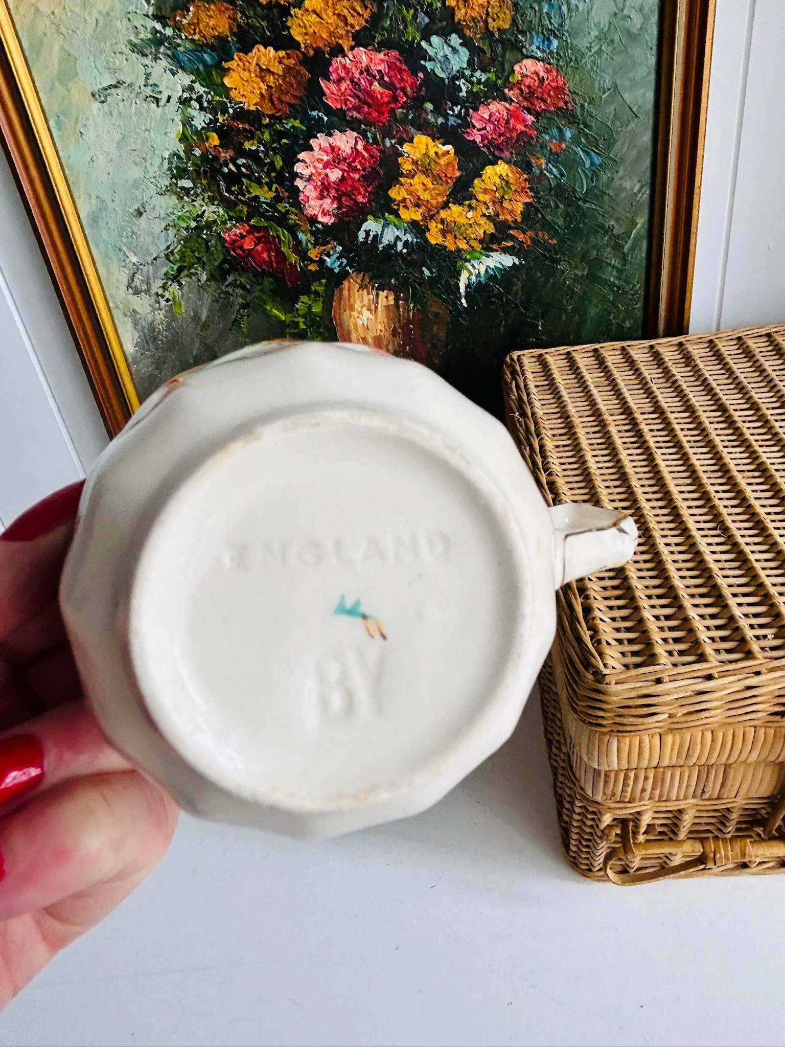 Underside of one teacup showing the impressed England backstamp and base