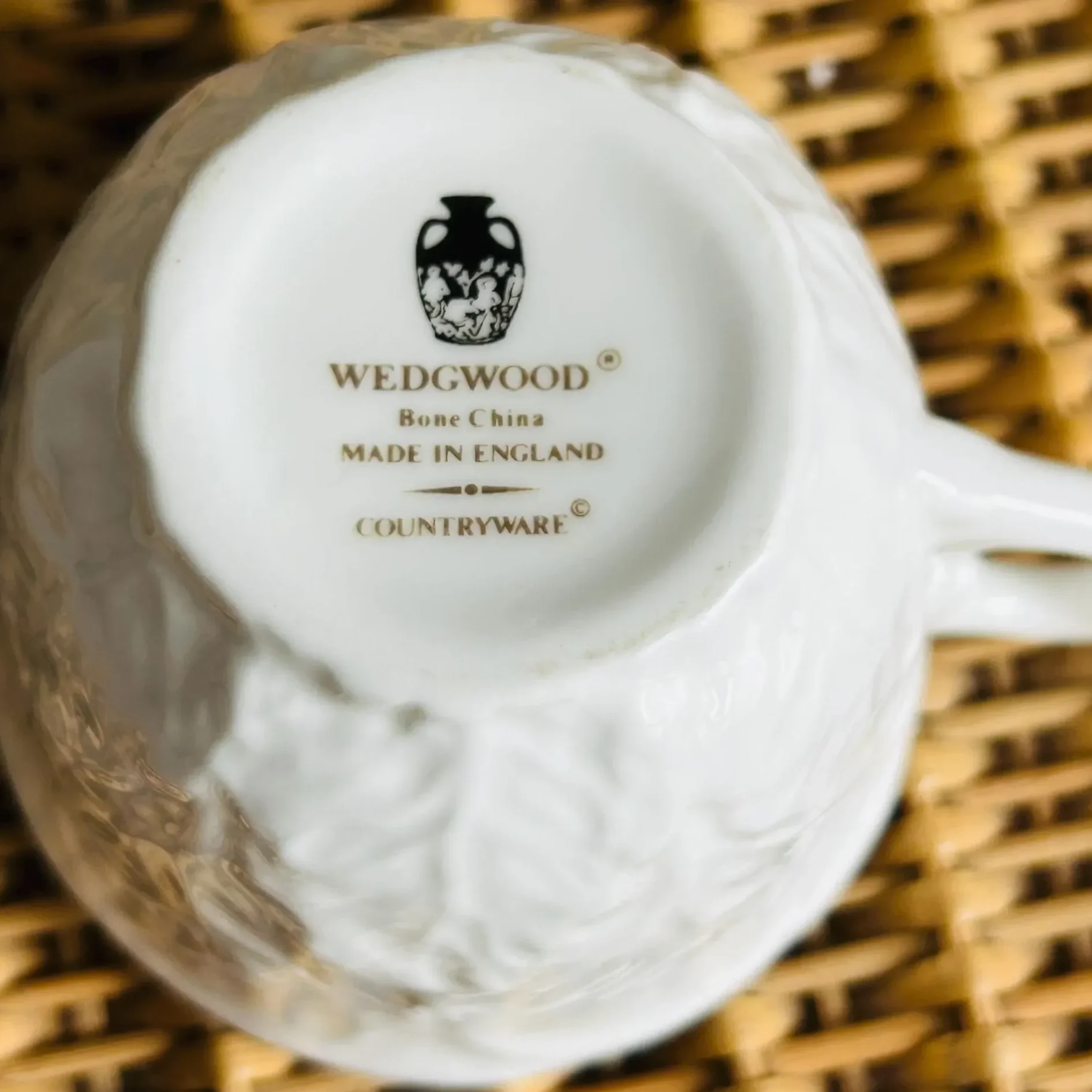 Base of a Wedgwood Countryware bone china cup showing the Portland Vase logo, Bone China, Made in England, and Countryware pattern name in gold text