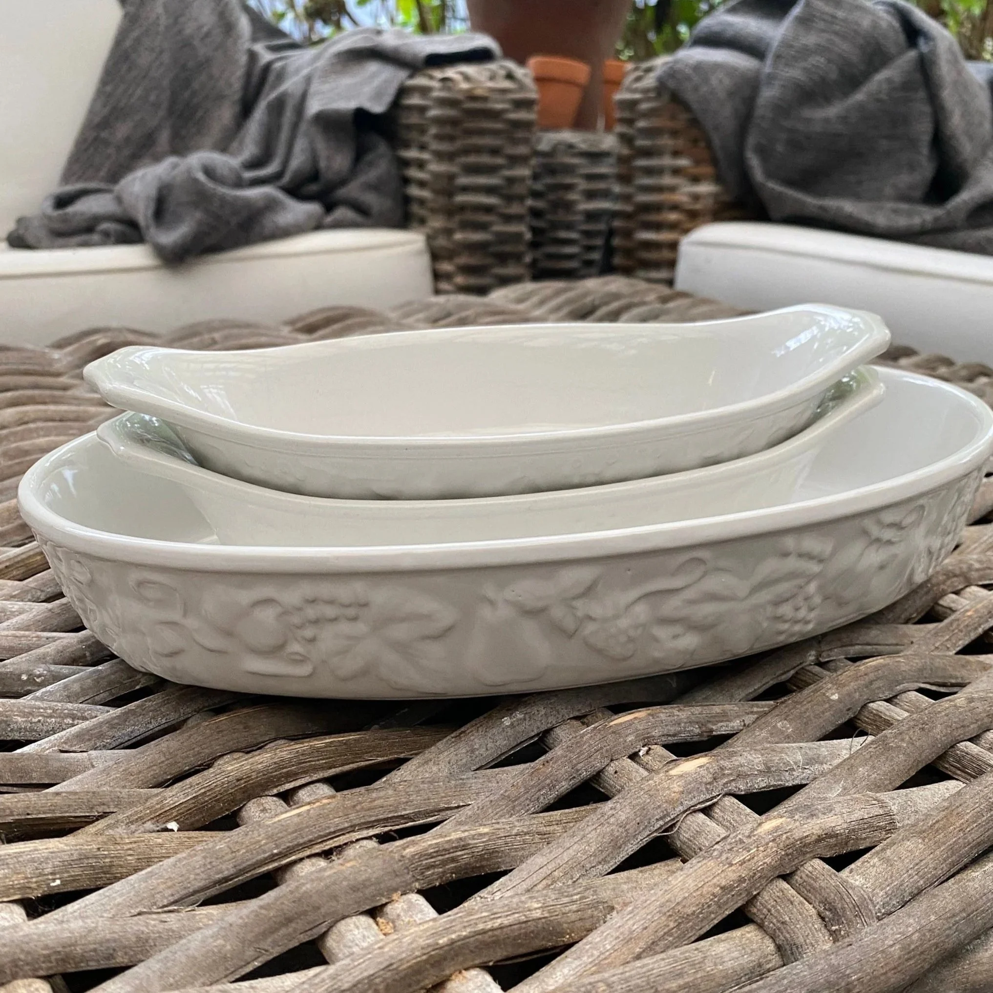 Japanese ceramic baking dishes stacked showing embossed fruit design