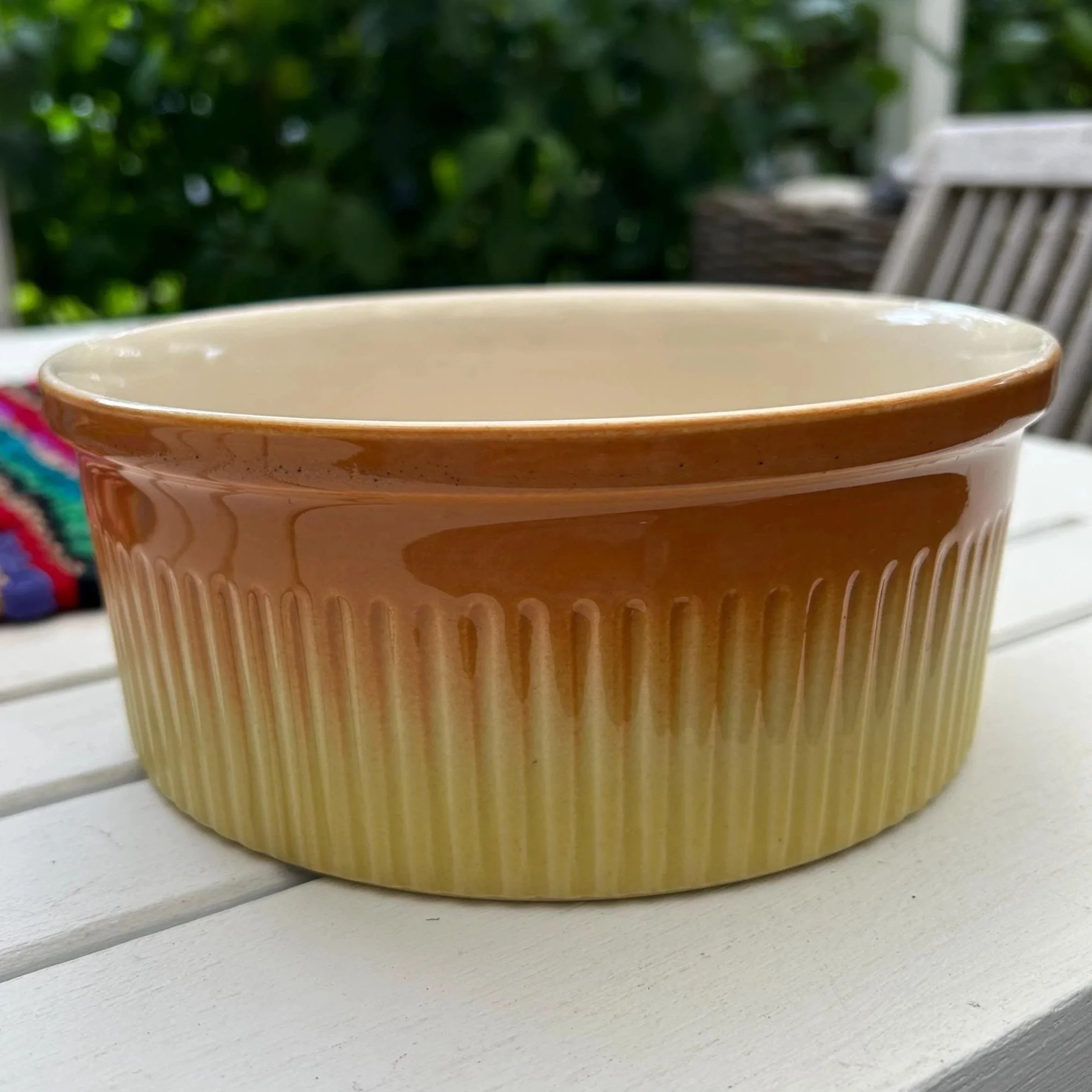 Side view of Petrus Regout Parafeu dish showing amber gradient and ribbed texture