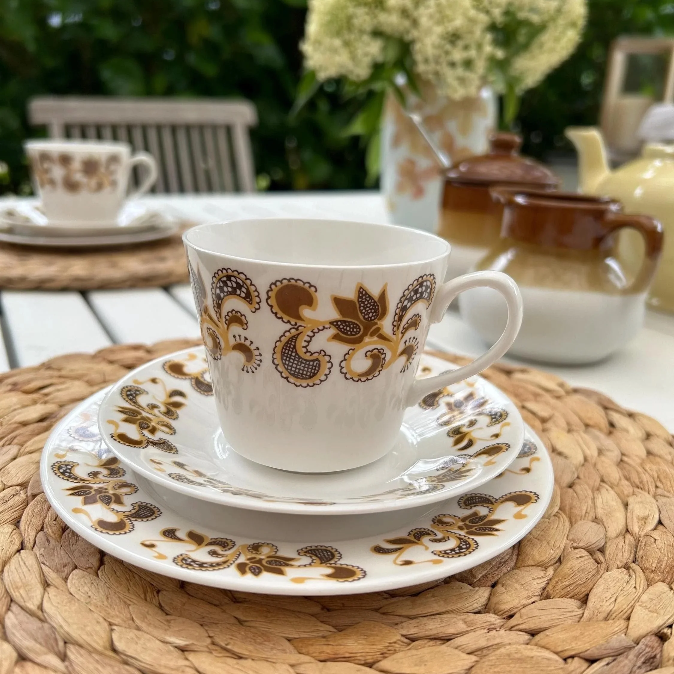 Teacup on saucer with matching plate styled for high tea