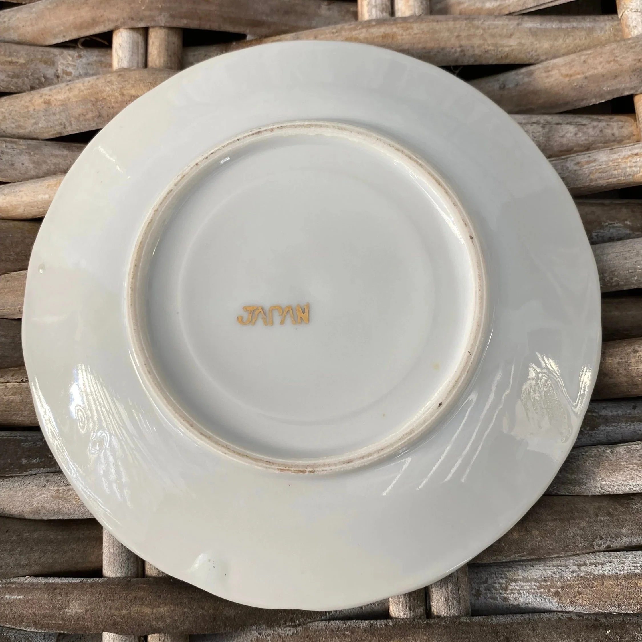 Underside of saucer stamped “Japan” in gold lettering