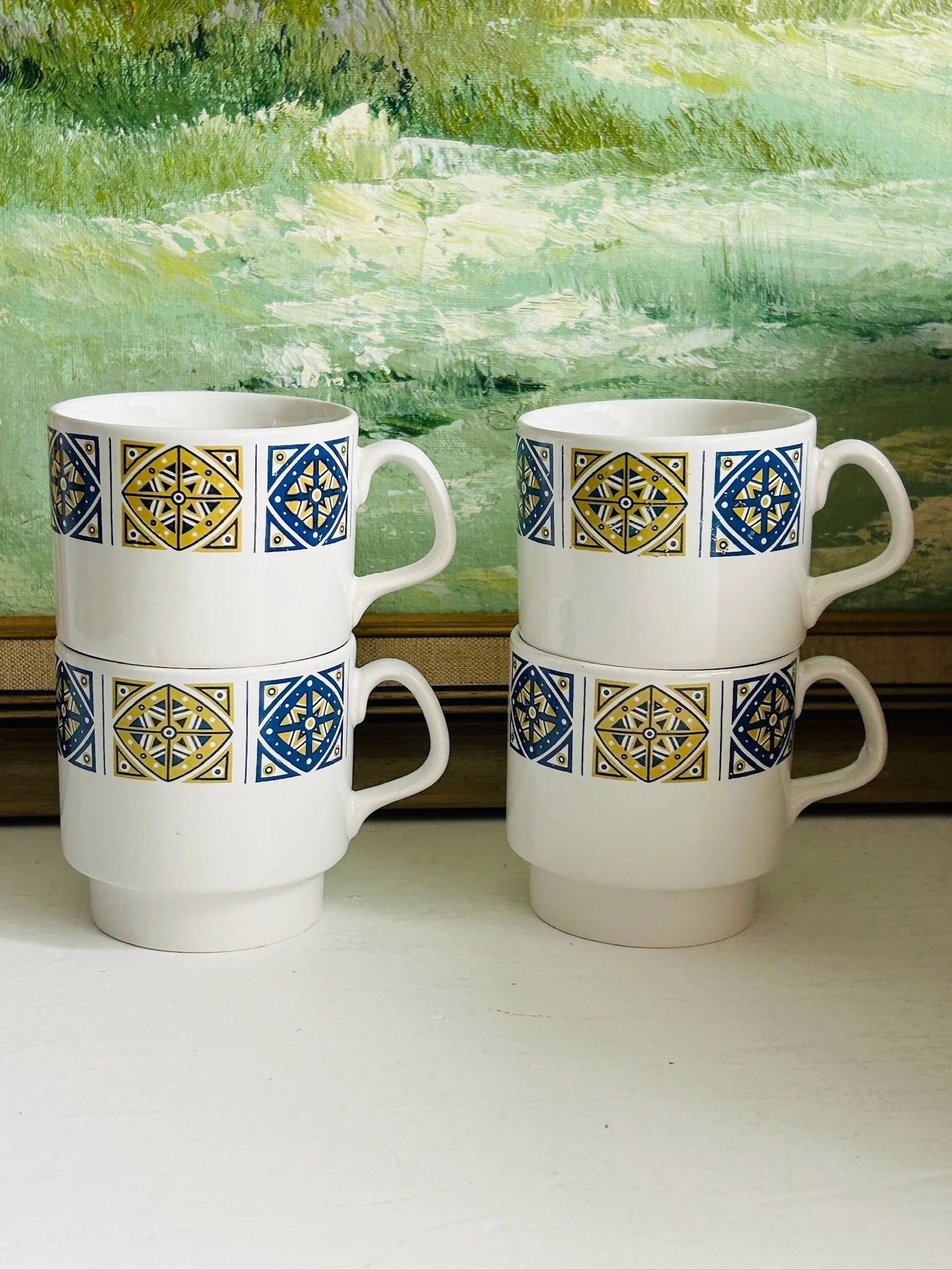 Two pairs of Staffordshire Midas cups stacked side by side, highlighting the set of four and stackable form