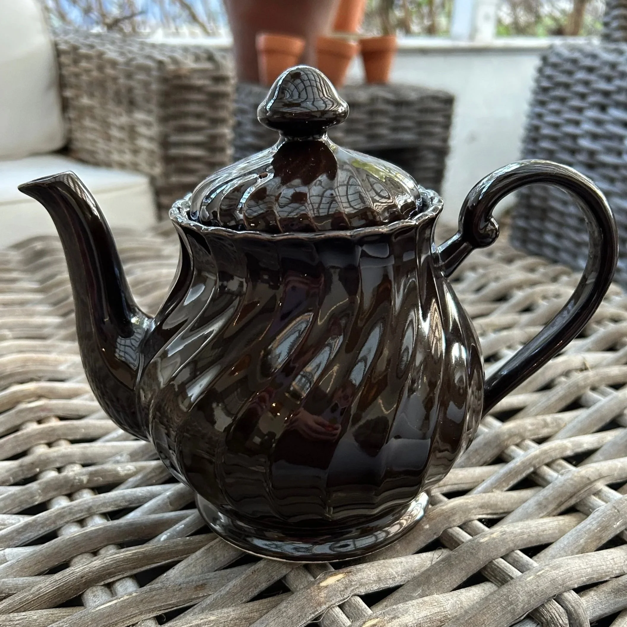 Full view of vintage Japanese dark chocolate brown ceramic teapot with lid