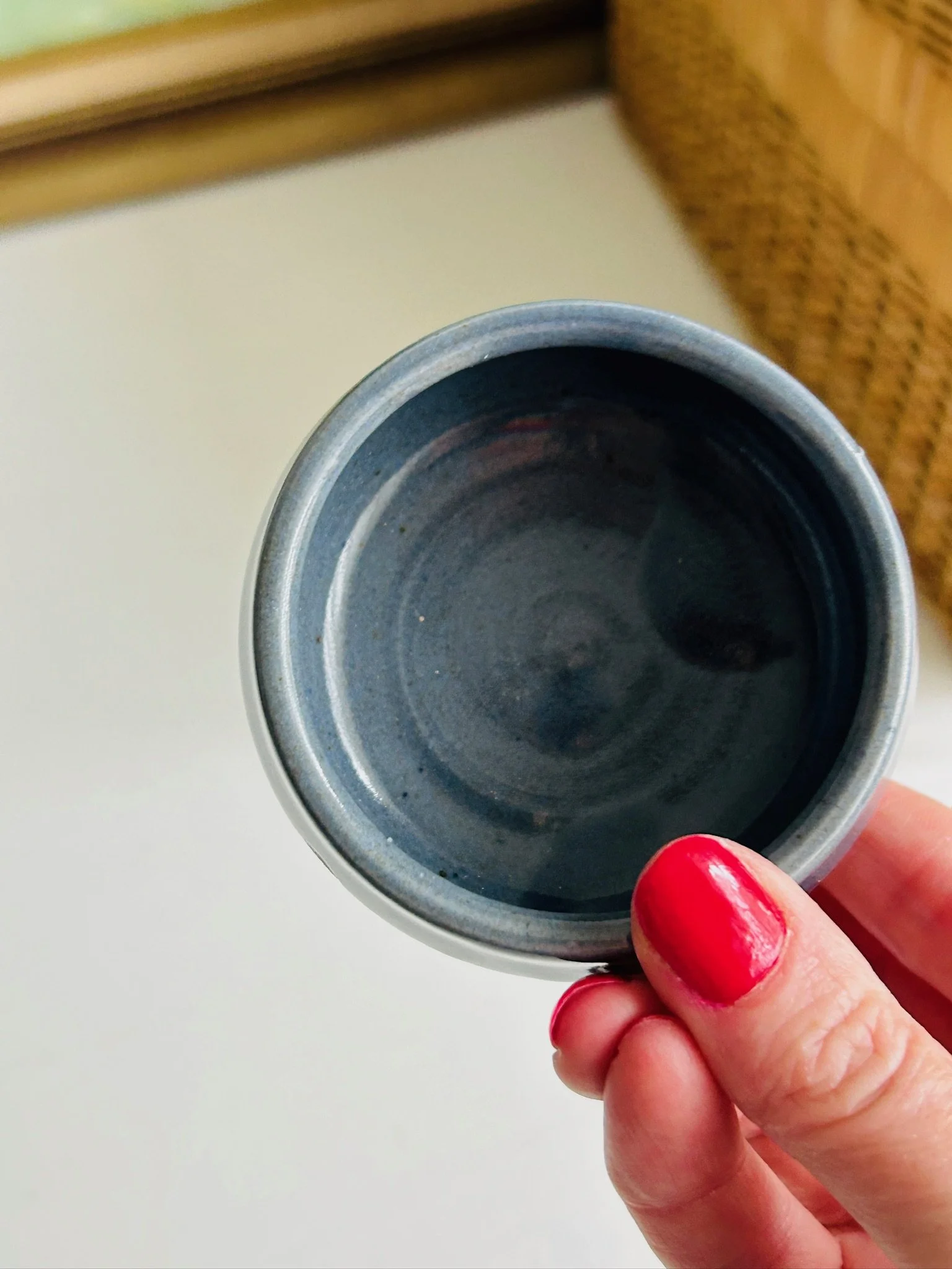 Top-down view into the bowl showing the circular wheel-thrown interior and blue-grey glazed surface