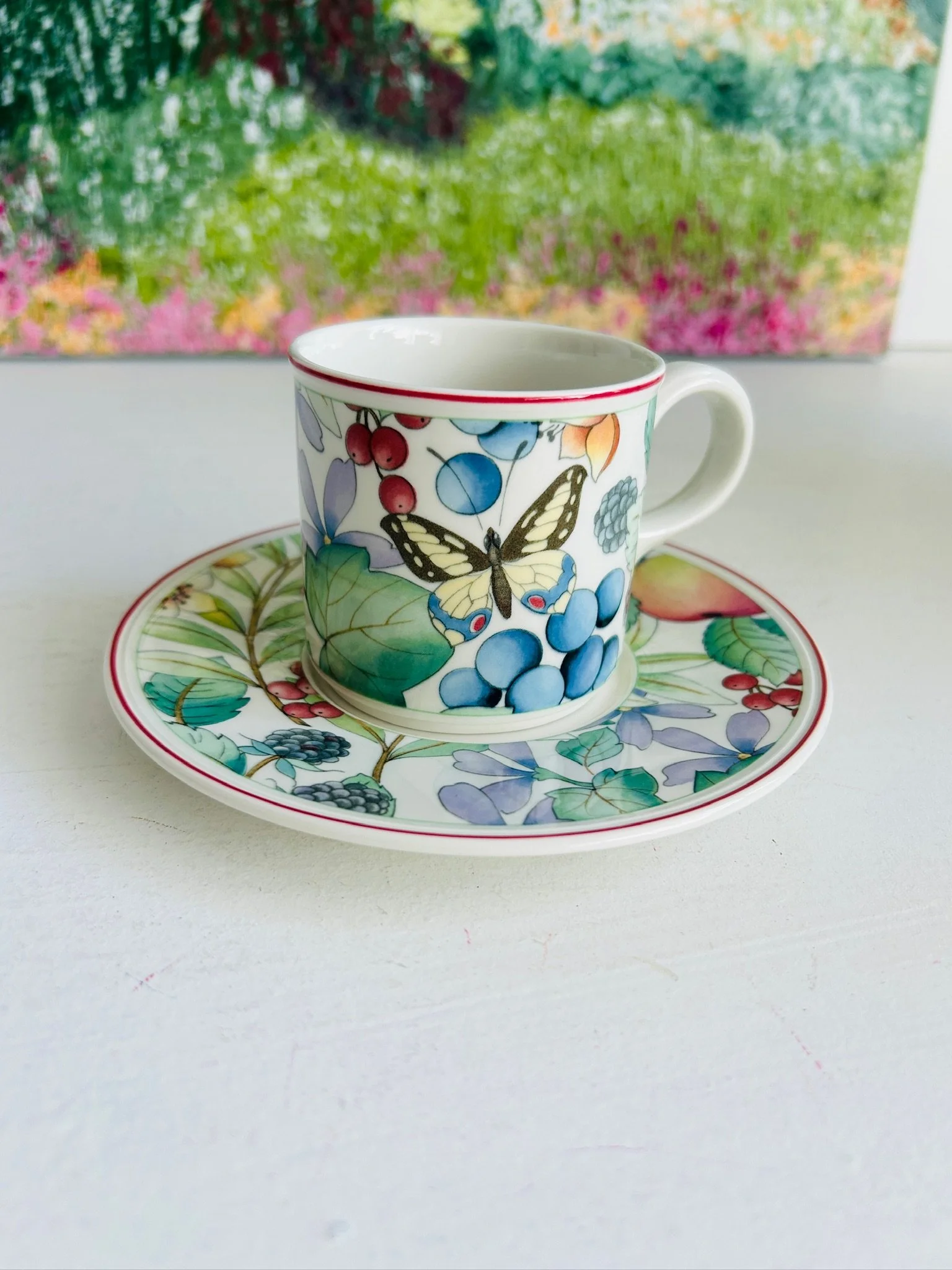 Villeroy & Boch Catalina coffee cup and saucer displayed together, showing the colourful berry and butterfly pattern on vintage German porcelain.