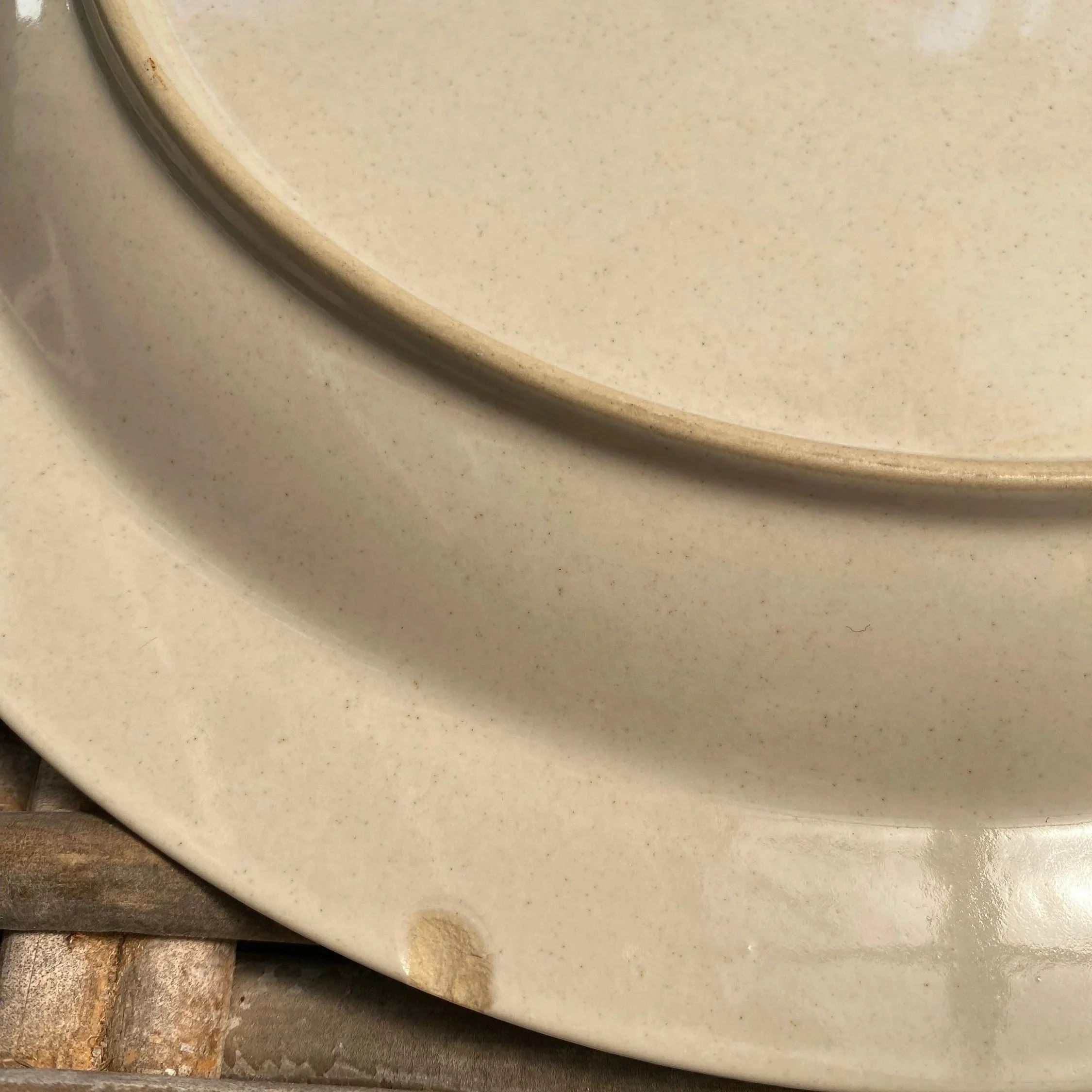 Close-up of minor chip on the underside rim of the plate