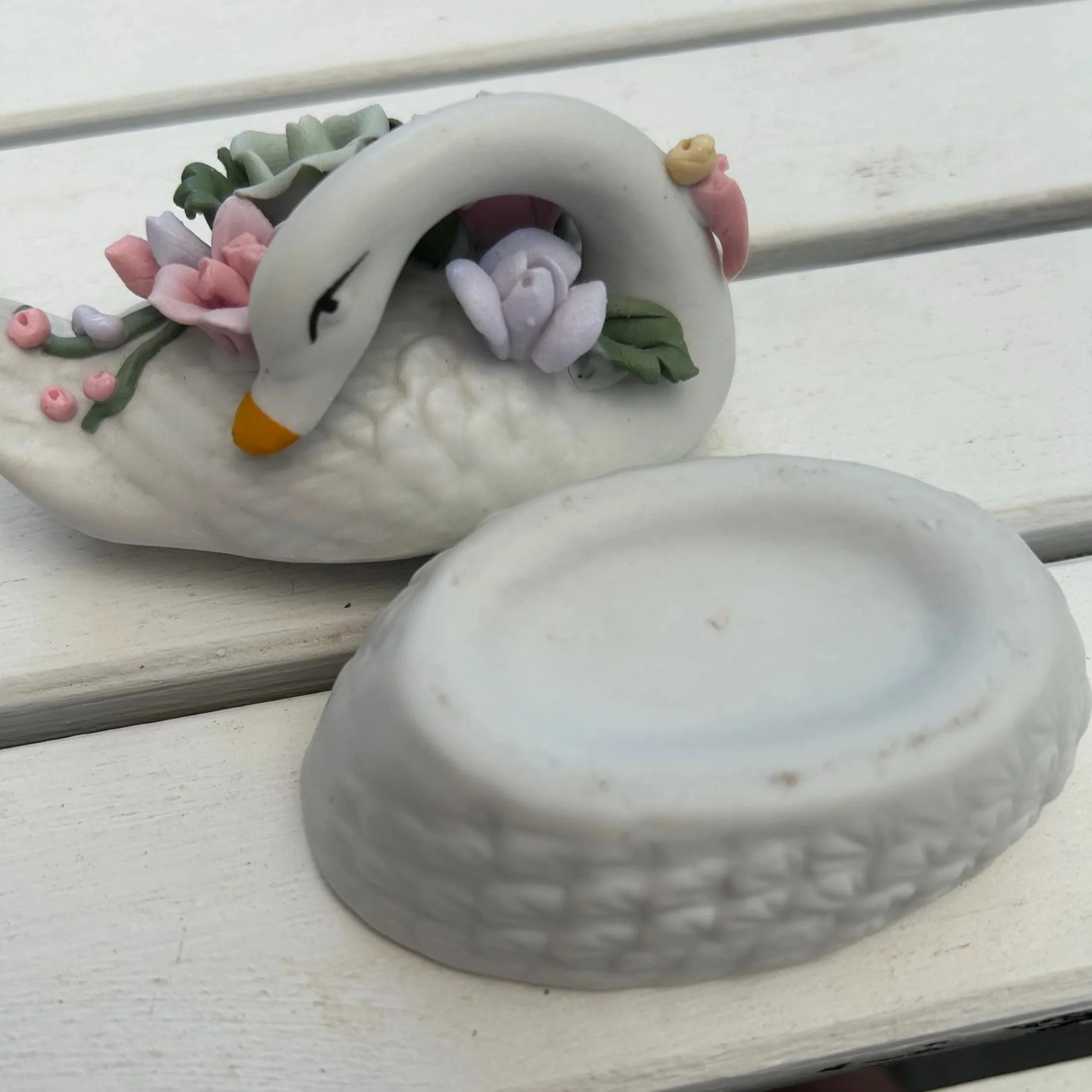 Swan trinket box with lid removed, placed beside the base