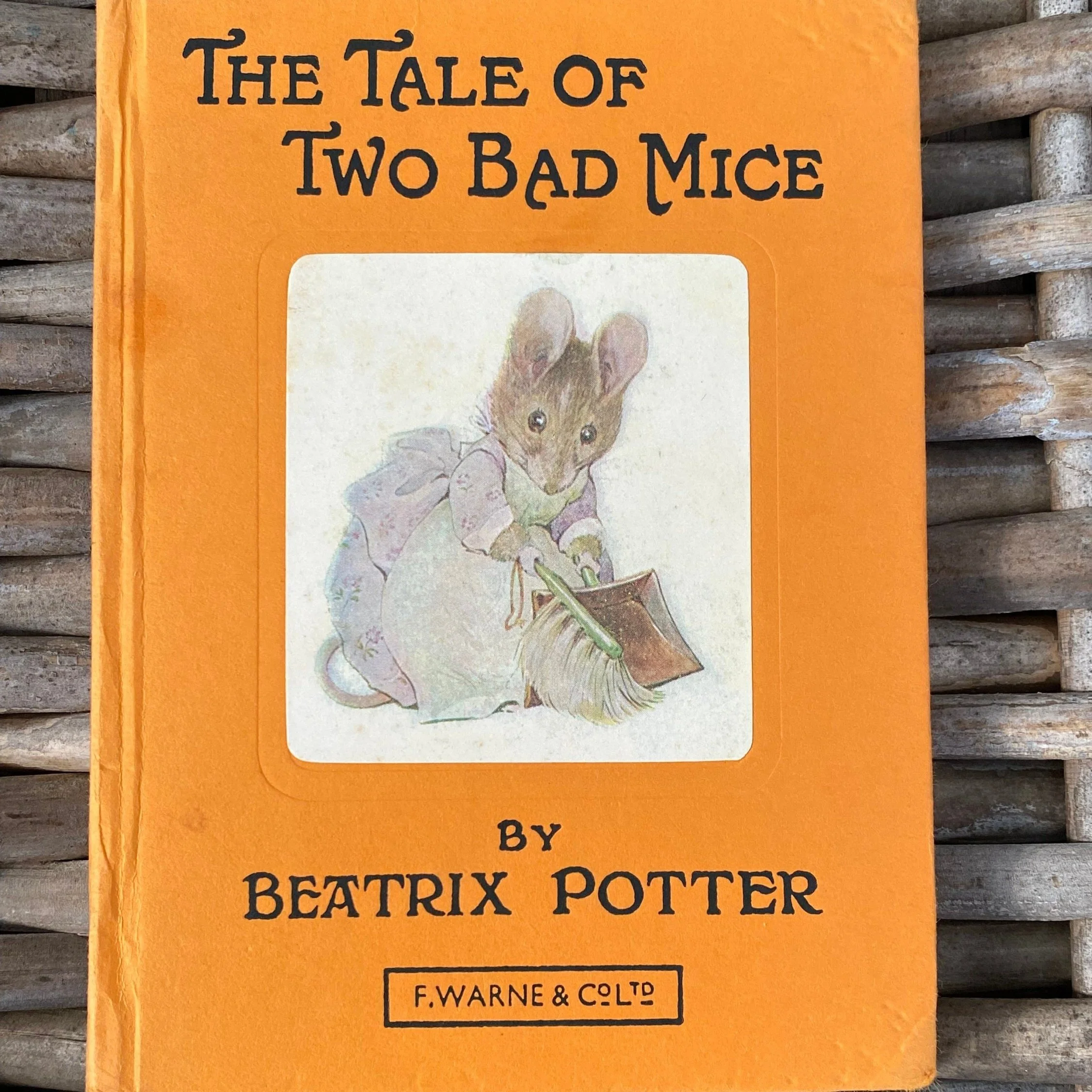 1975 edition of Beatrix Potter’s The Tale of Two Bad Mice, featuring colourful illustrations and a handwritten Christmas inscription. A collector’s gem.