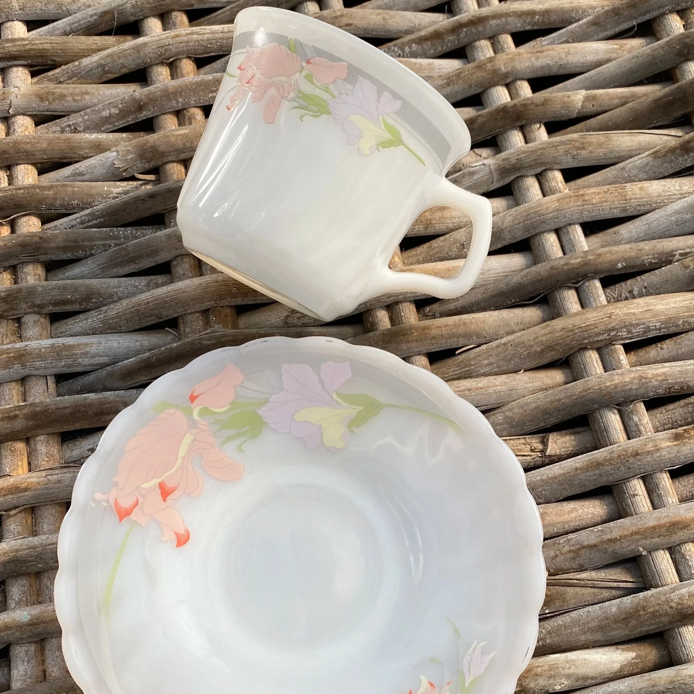 Angled top-down view of a single cup resting on saucer