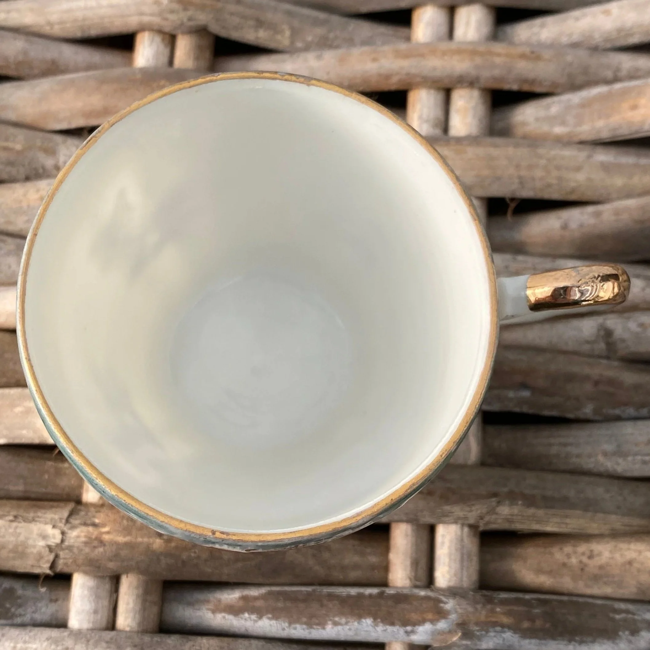 Interior view of teacup with gold rim