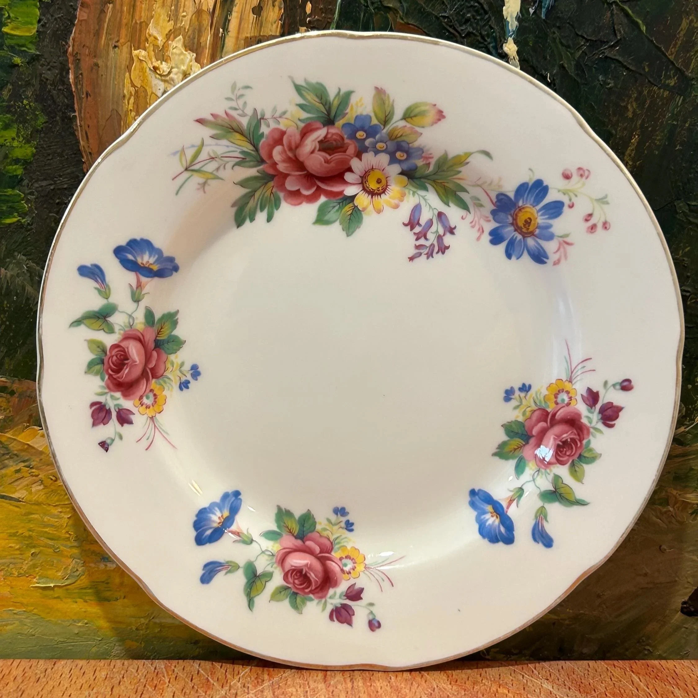 Plate detail showing vibrant floral transfer and blue accents