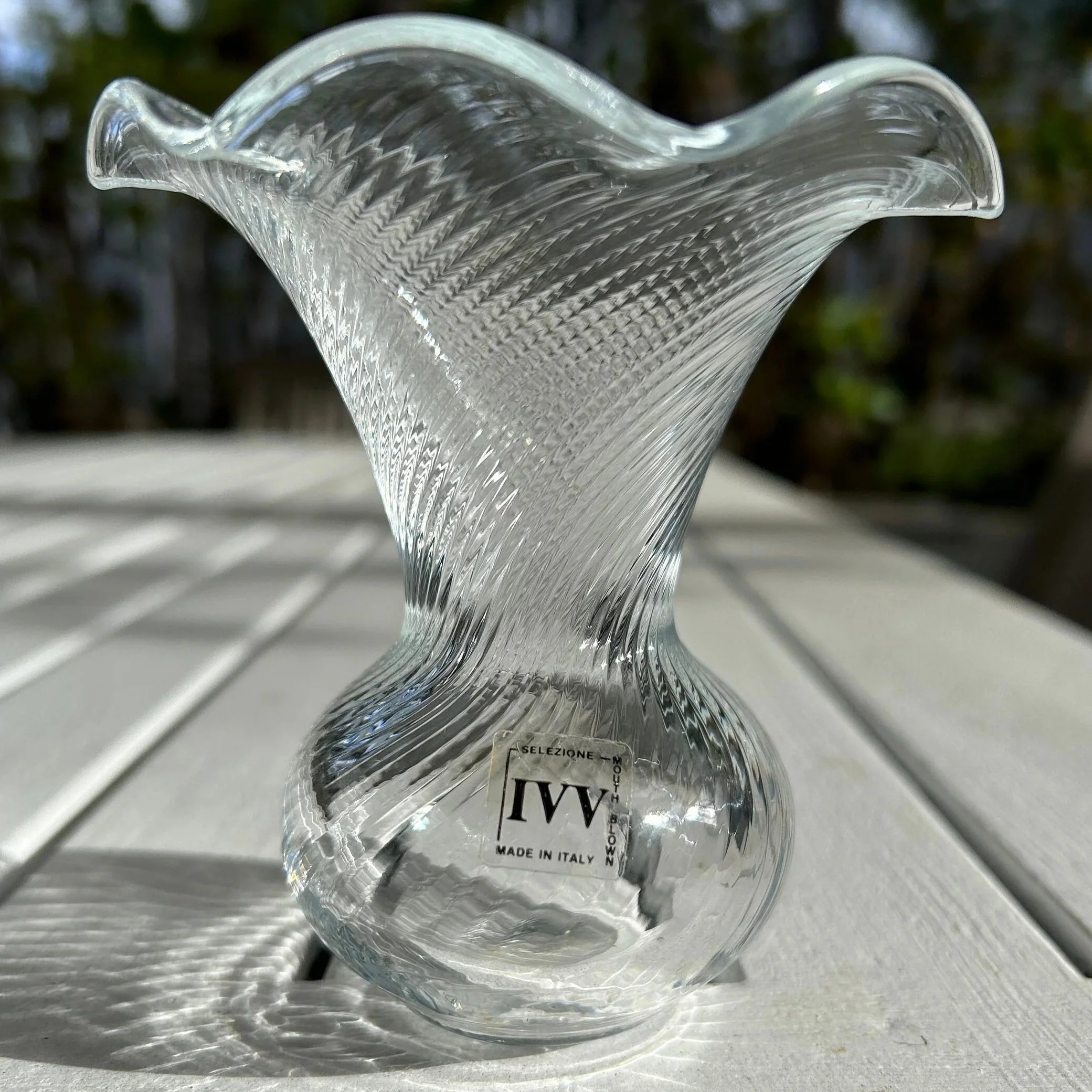 Close-up side view of one vase showing original IVV label and ribbed pattern