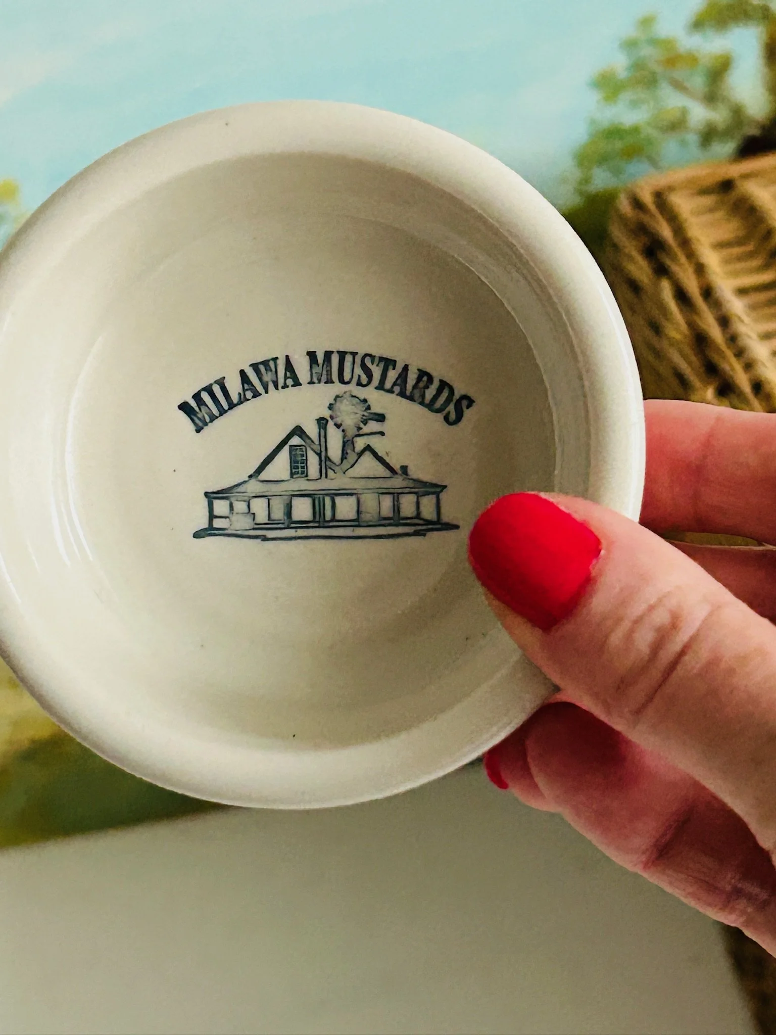 Close-up of the second bowl held in hand with printed factory logo inside