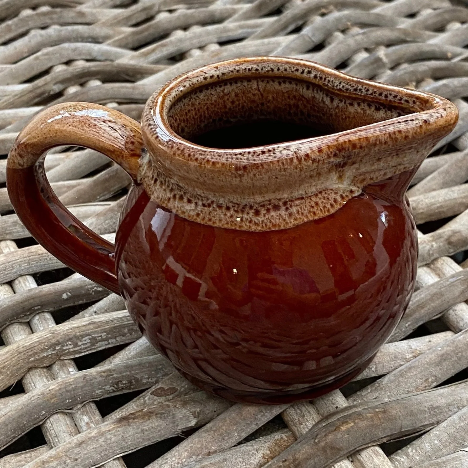 Side view highlighting rounded shape and vintage finish