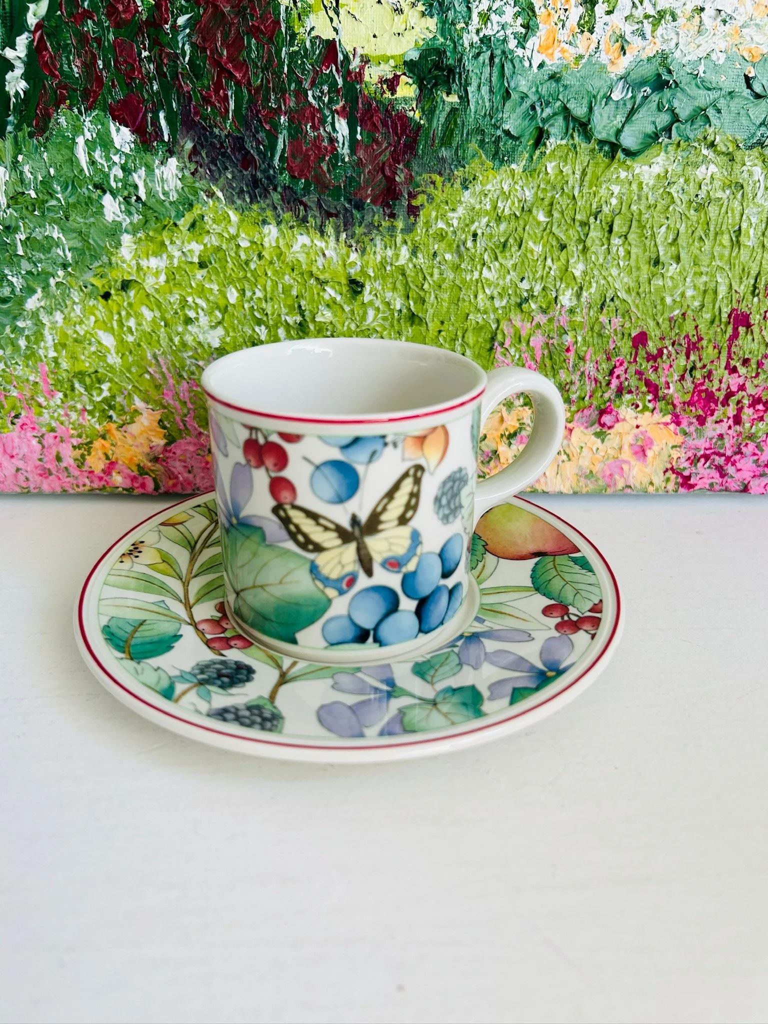 Full display of the Villeroy & Boch Catalina cup and saucer set styled against a colourful floral background.