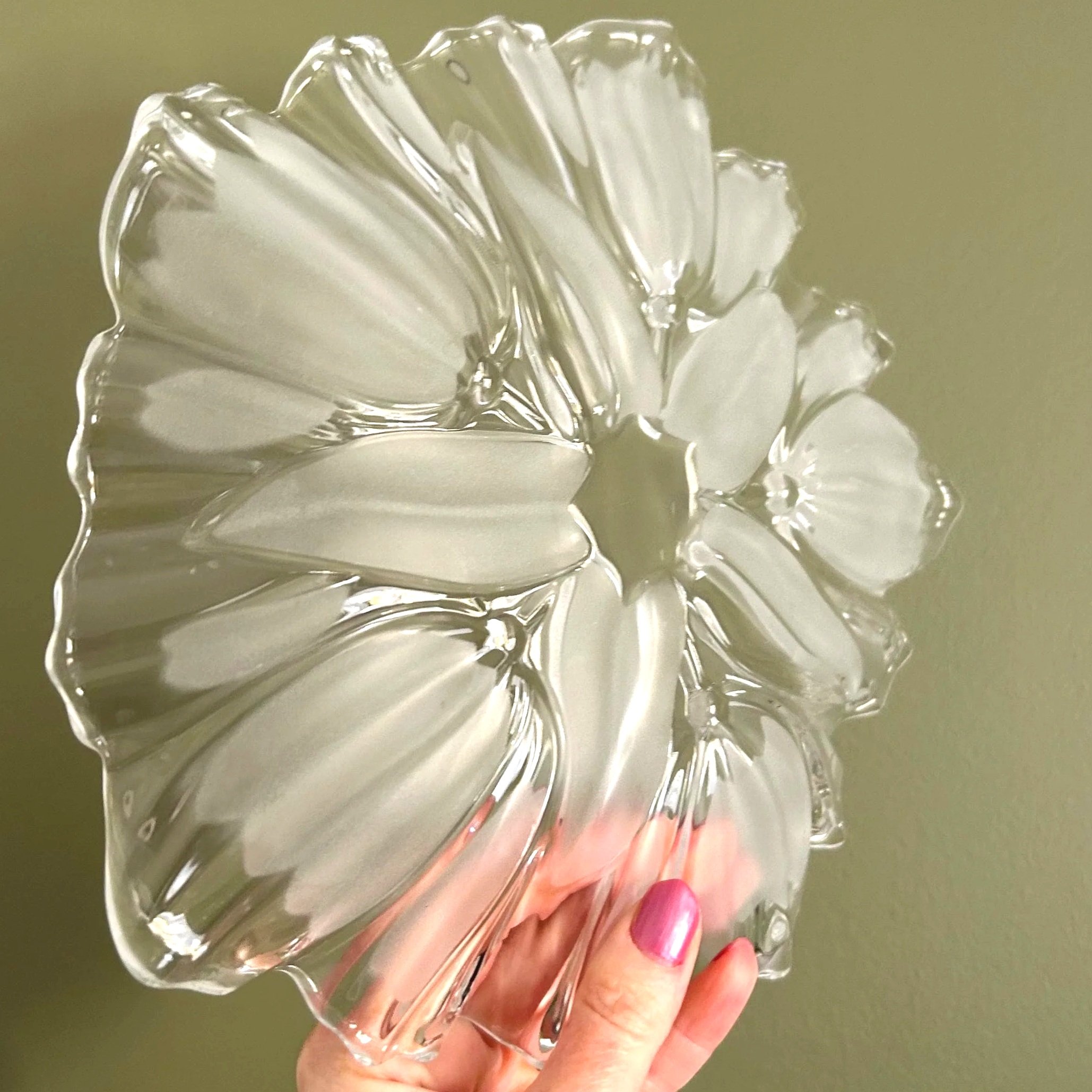 Angled shot of clear plate – sculptural glass shape highlighted