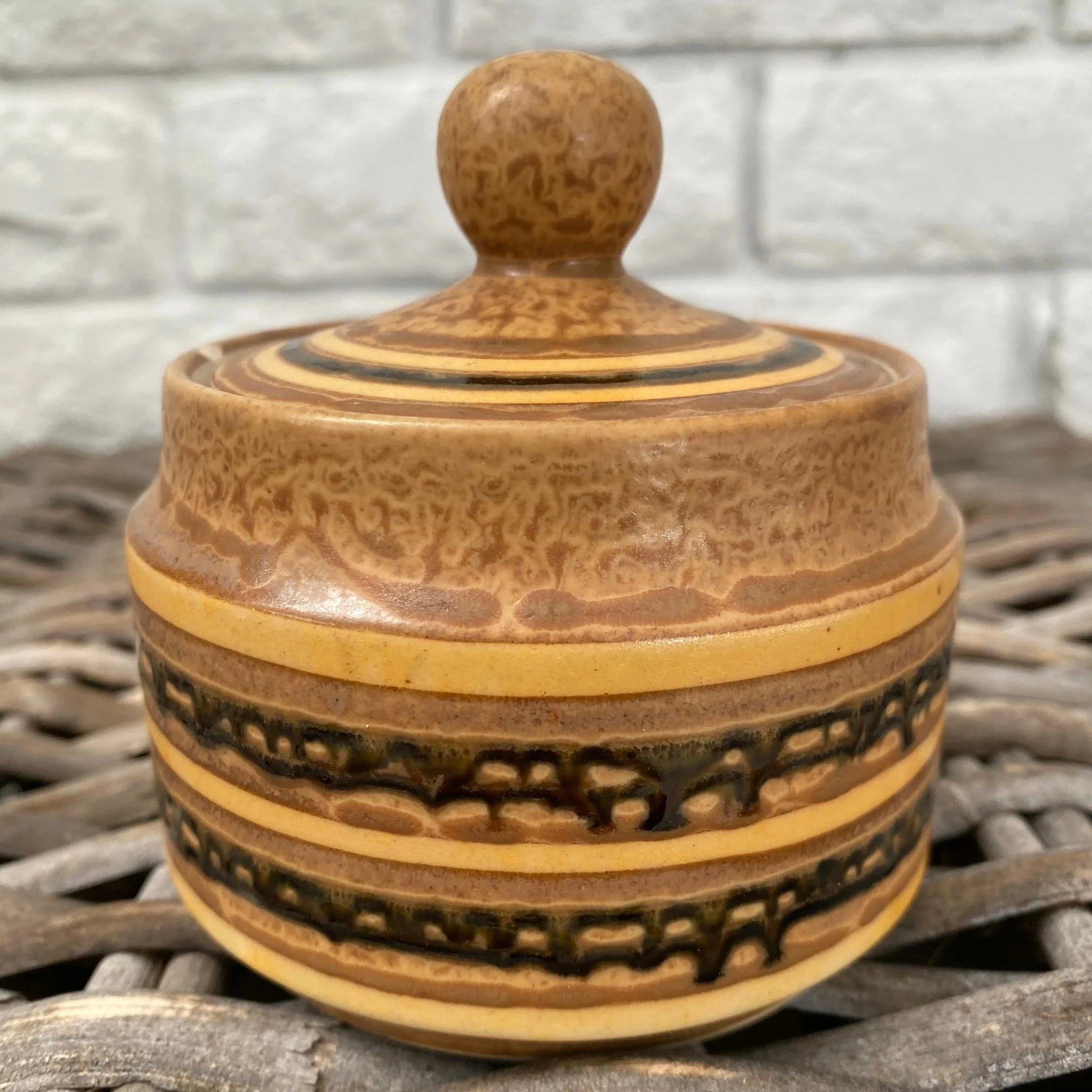 Close-up of sugar pot lid with round handle