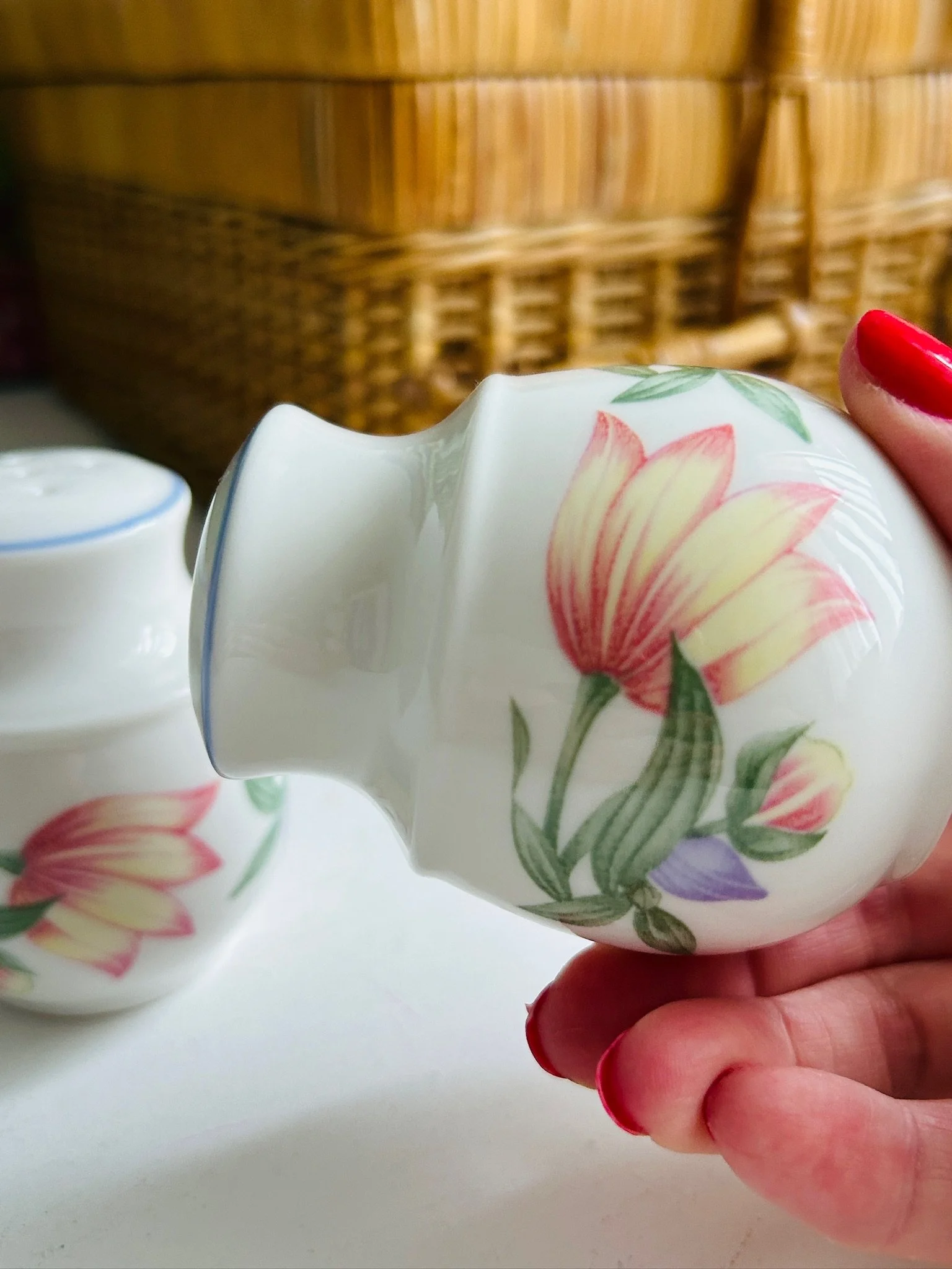 Close-up of one Royal Doulton Blooms shaker held sideways, showing the floral pattern wrapping around the body