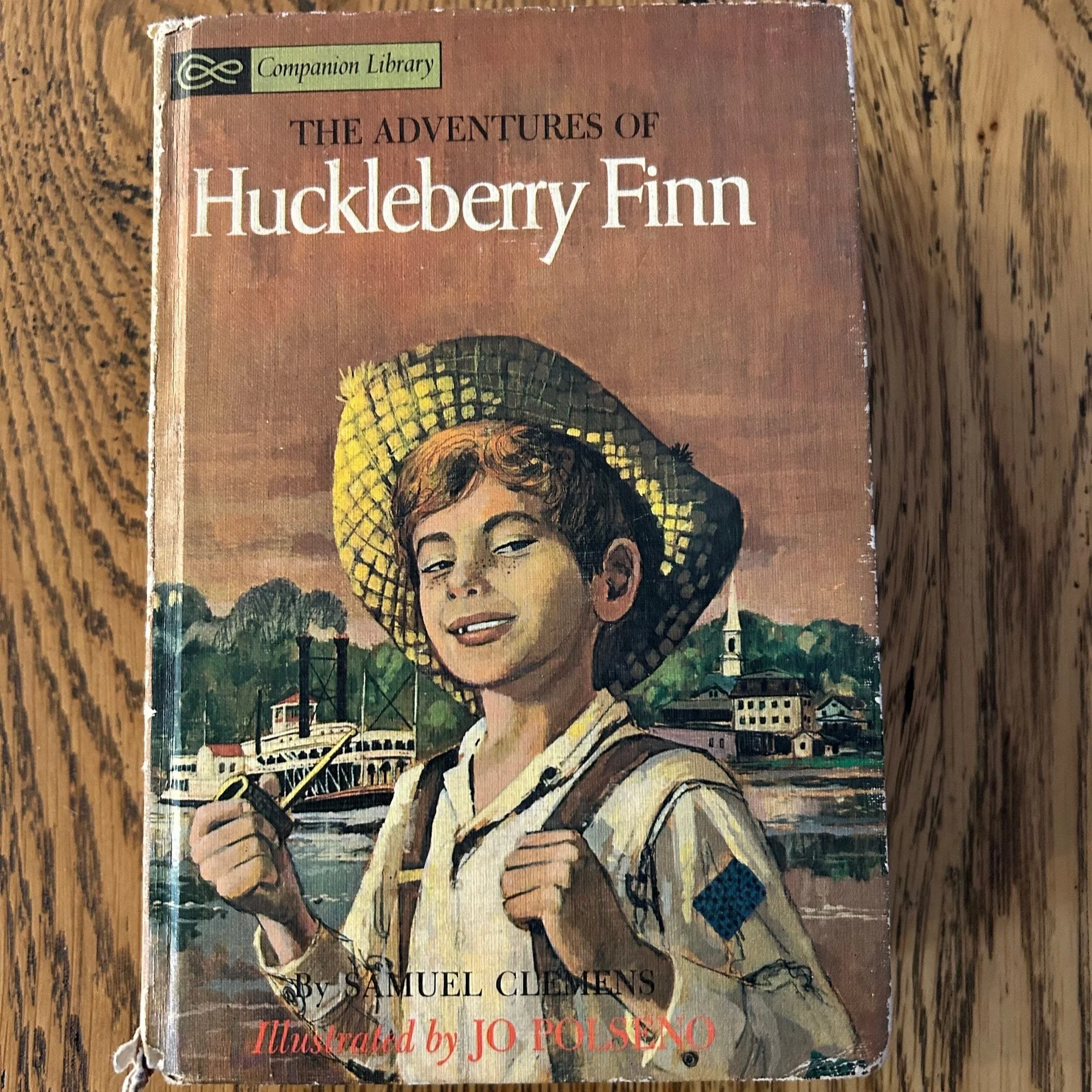 Cover close-up of ‘The Adventures of Huckleberry Finn’ illustrated by Jo Polseno