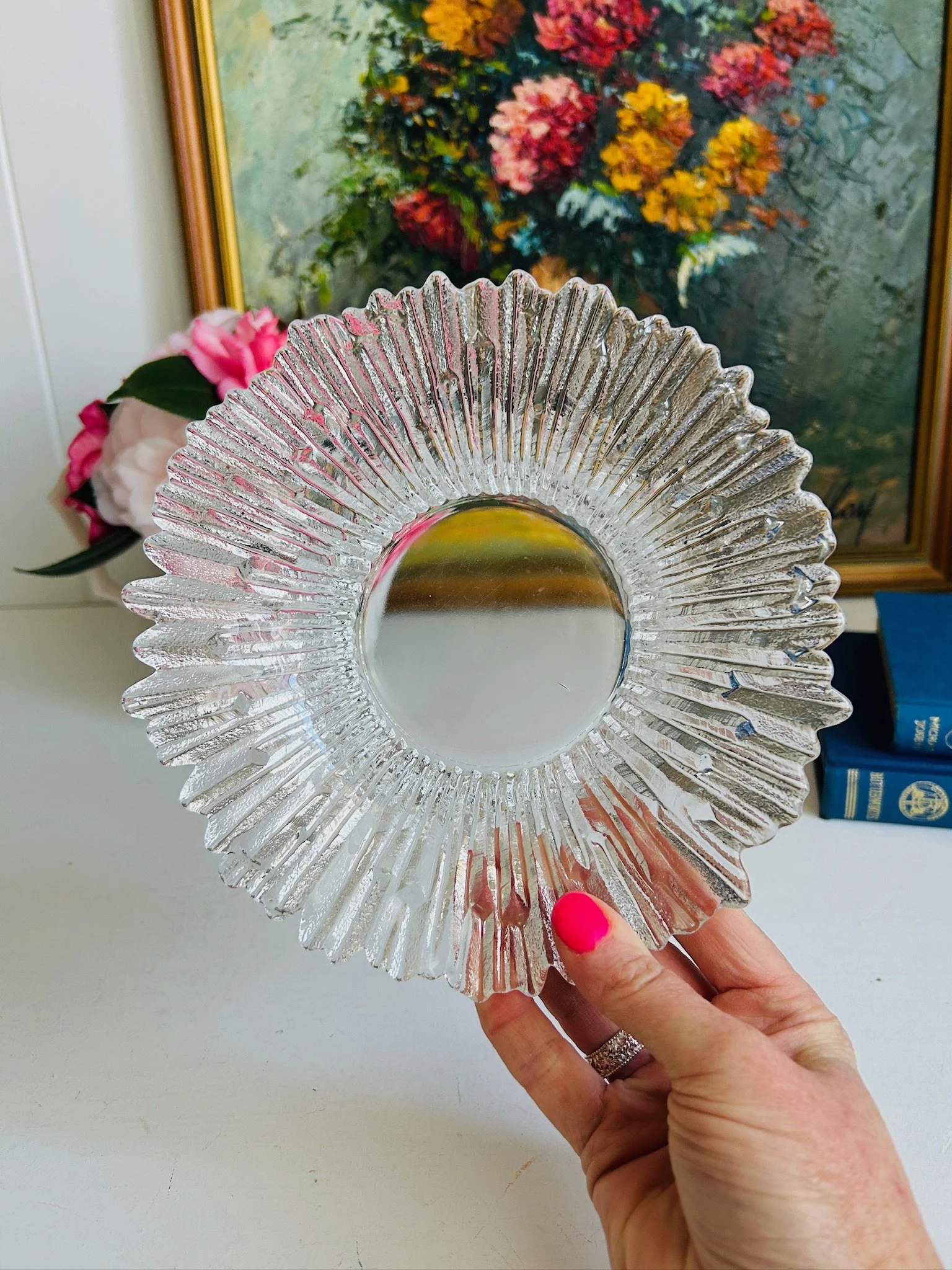 Tauno Wirkkala Kalevala glass dish held face-on, radiating icicle spines surrounding a smooth polished well