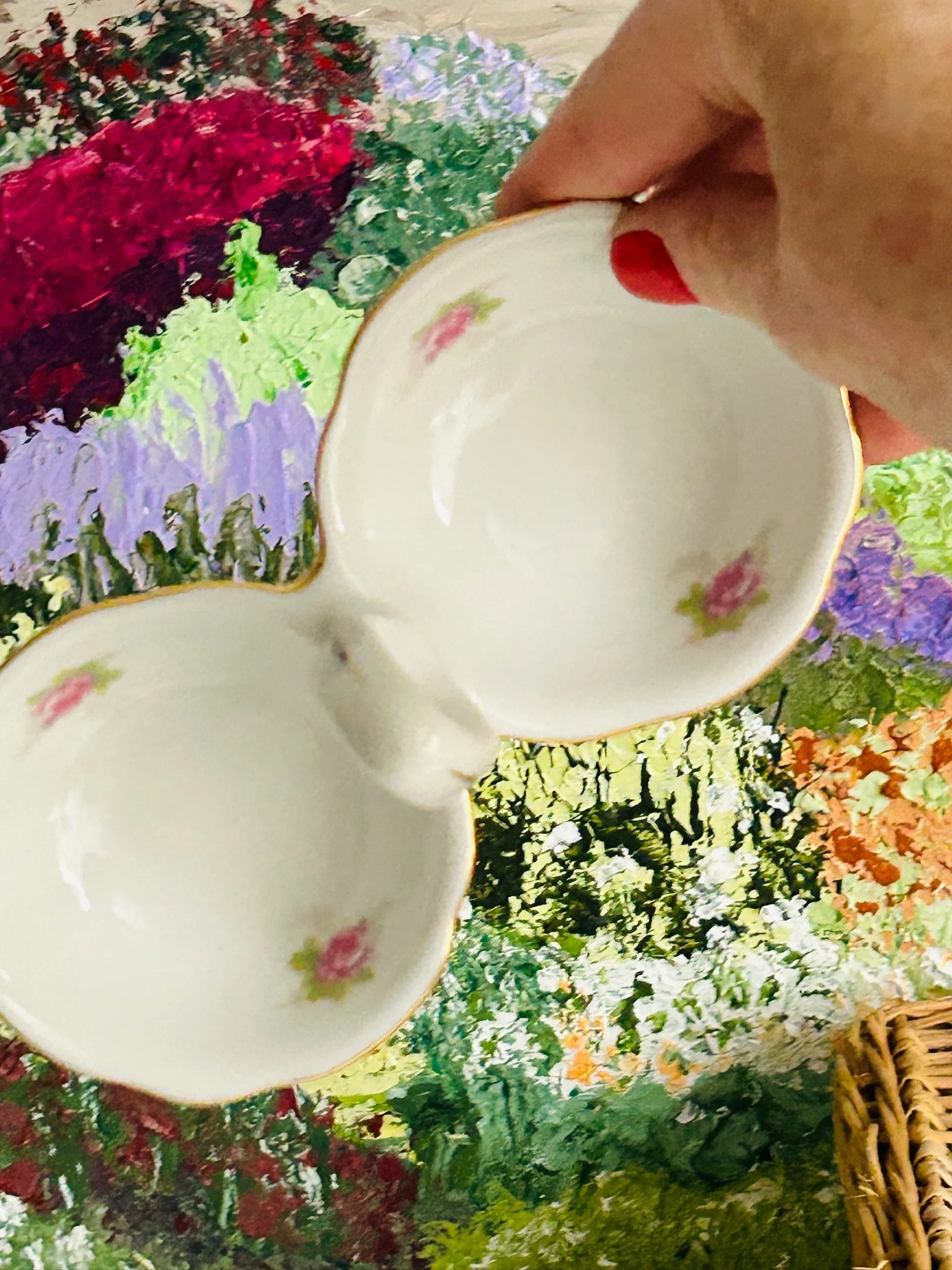 Side perspective of the double salt cellar held in hand, showing scale and shape