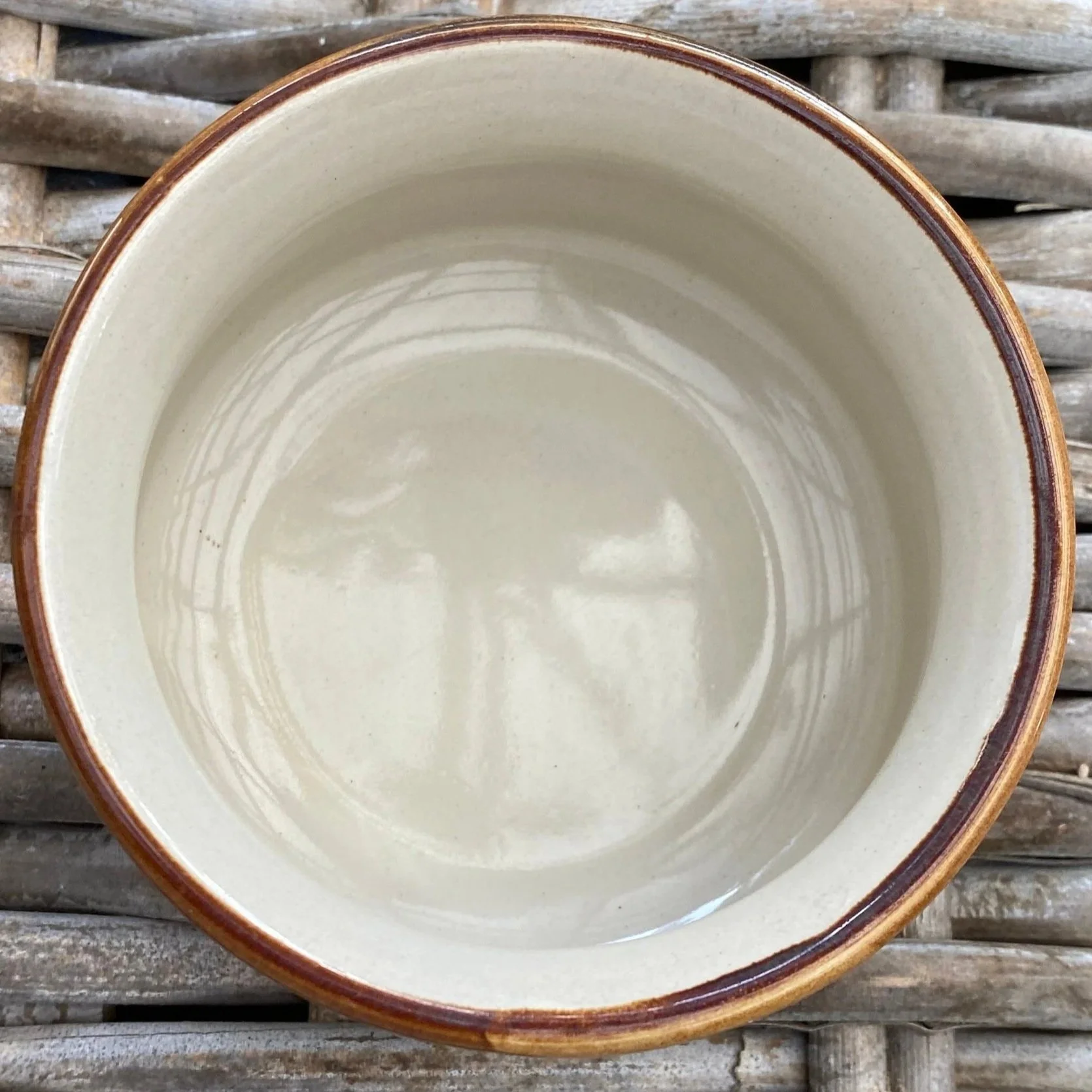 Top view of bowl interior with smooth cream glaze