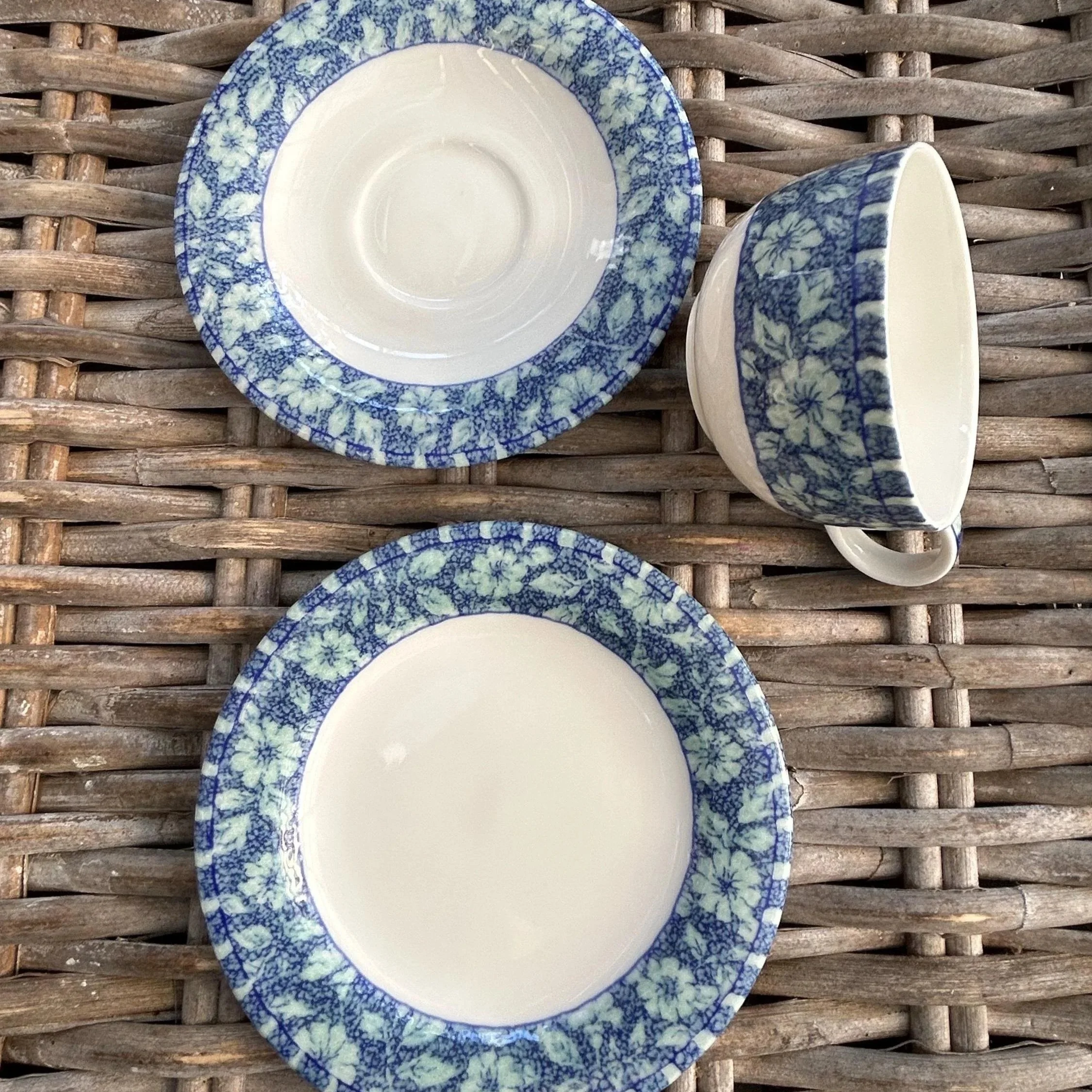Overhead shot of trios – cups and matching plates arranged neatly