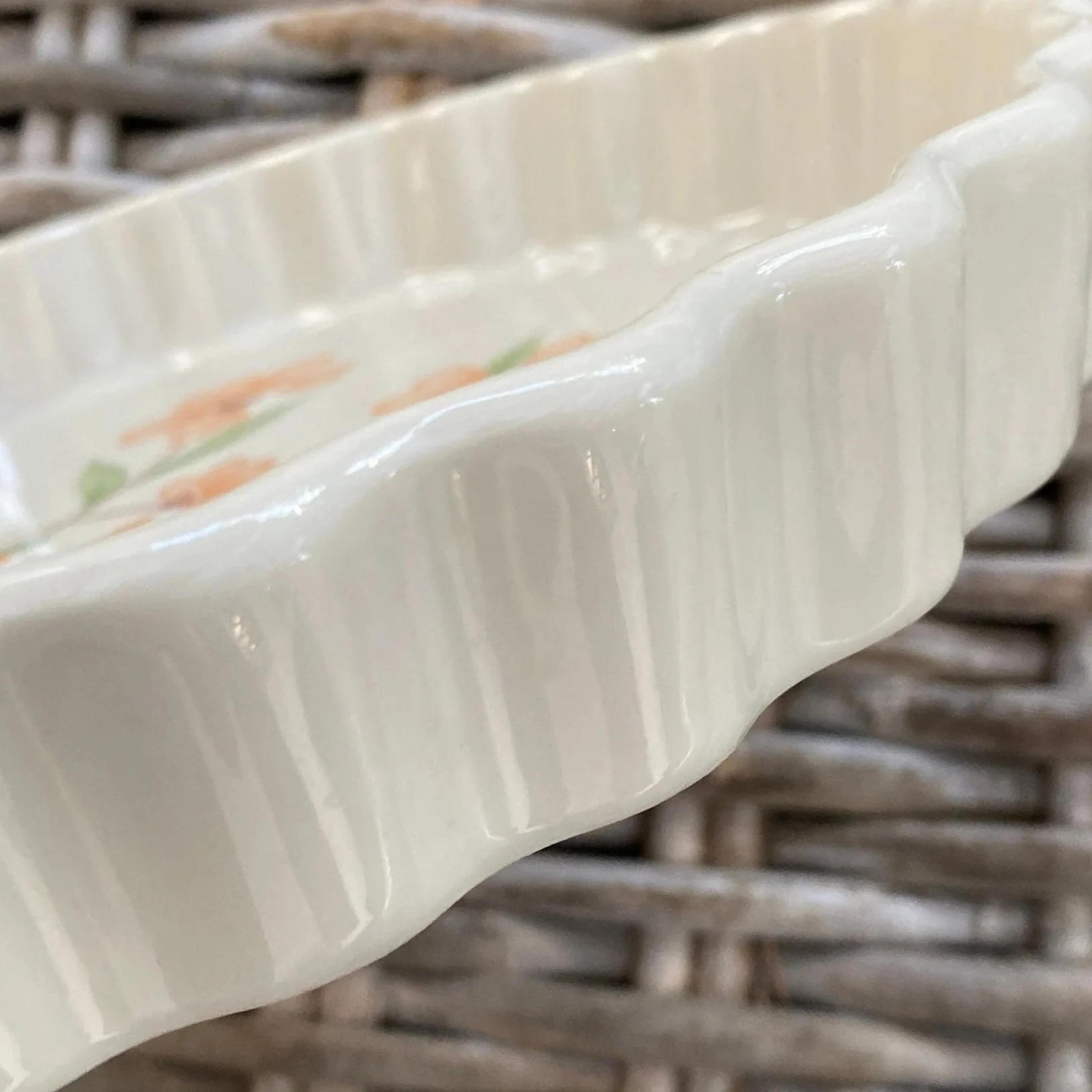 Side view showing ruffled edge and subtle ridging in glaze