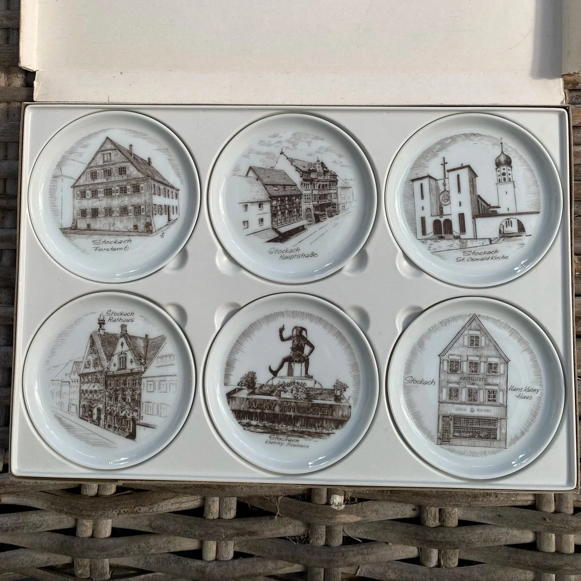 Overhead view of complete set of 6 coaster plates in original box