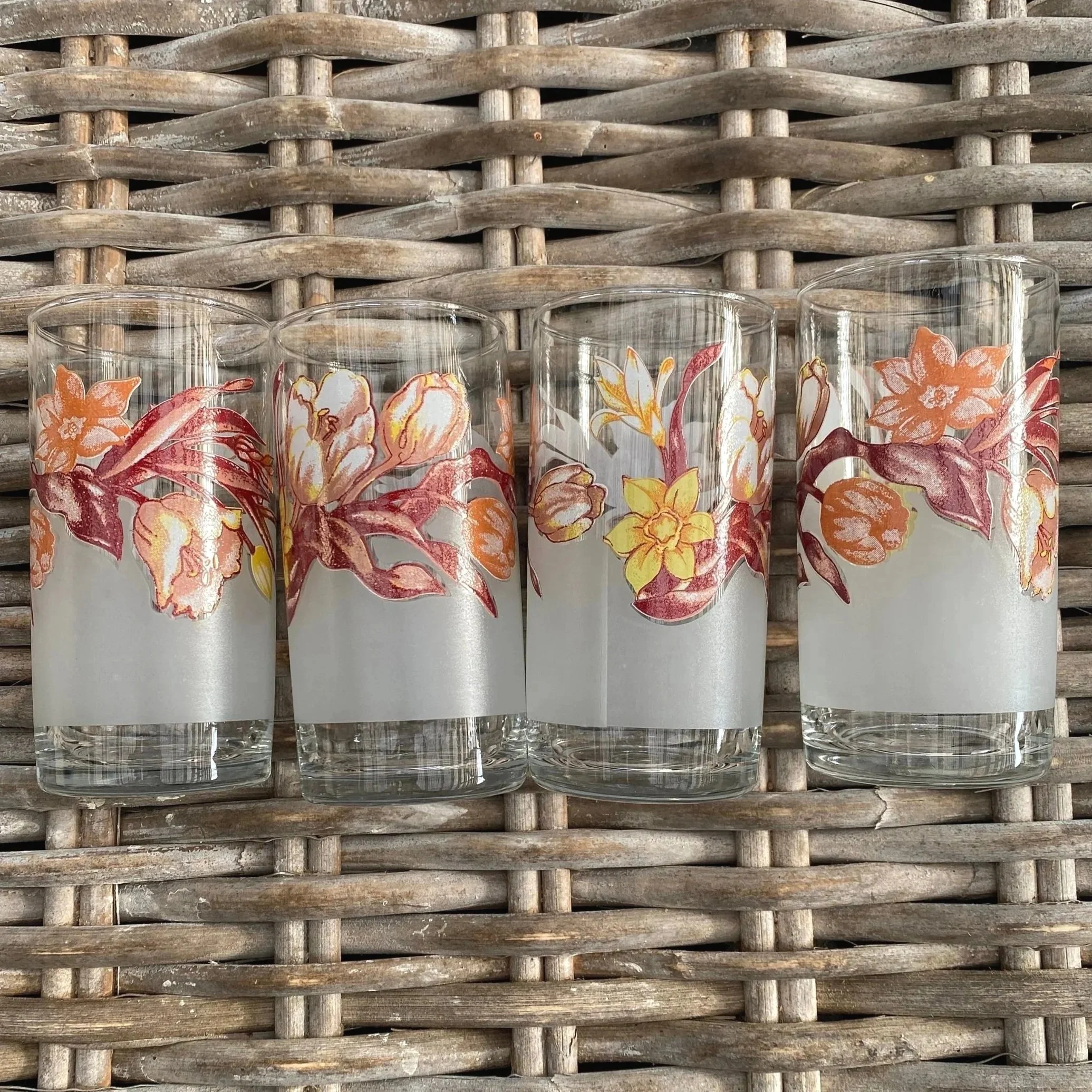 Close-up showing tulip-like orange and brown floral motif