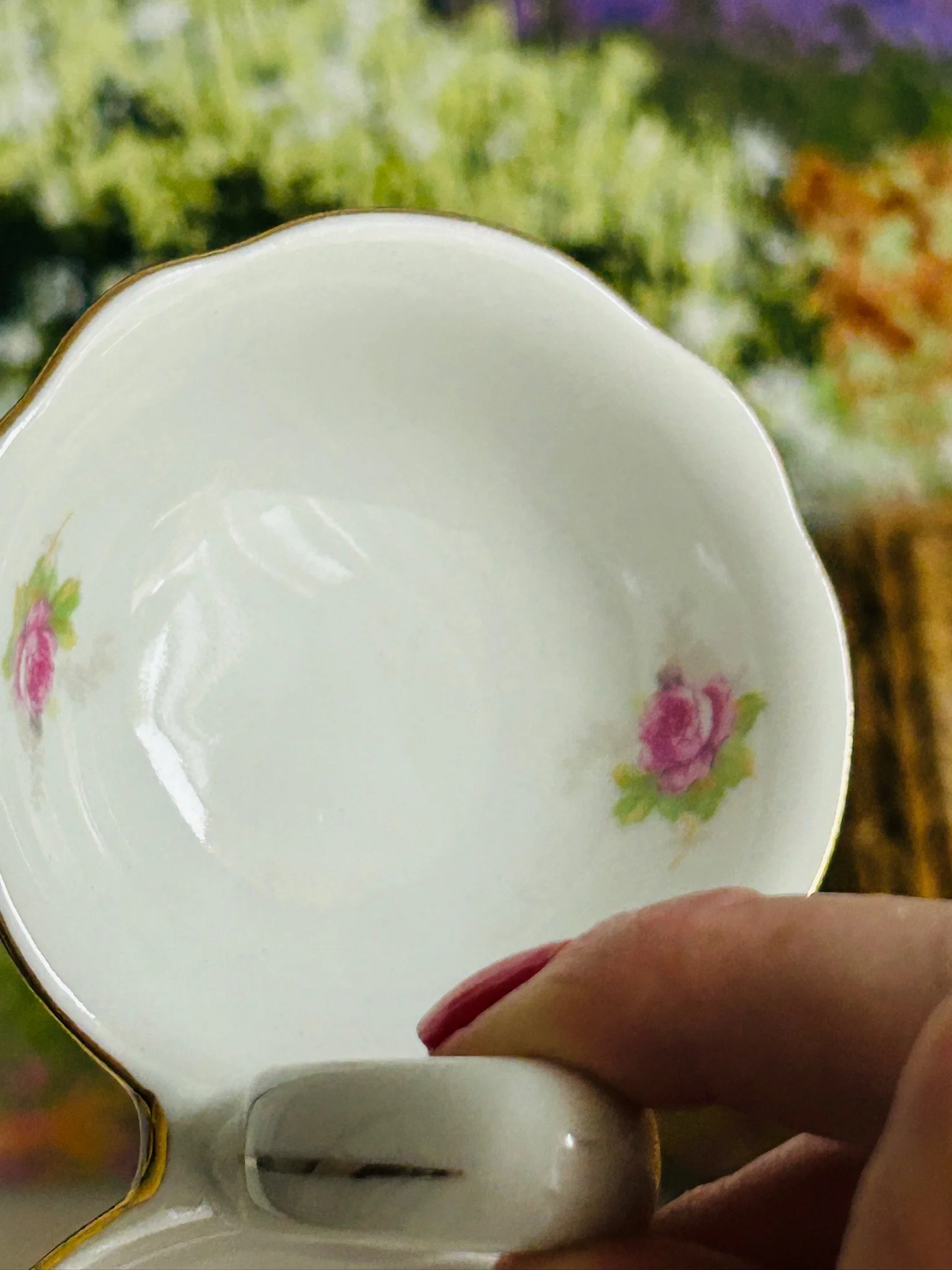 Close-up of one side of the cellar showing the curved bowl shape and floral decal