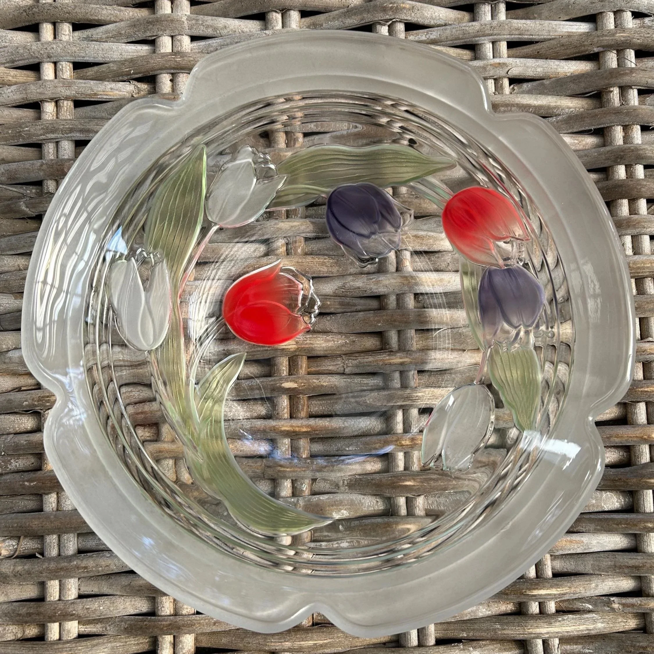 Overhead view of frosted glass bowl showing colourful raised tulips
