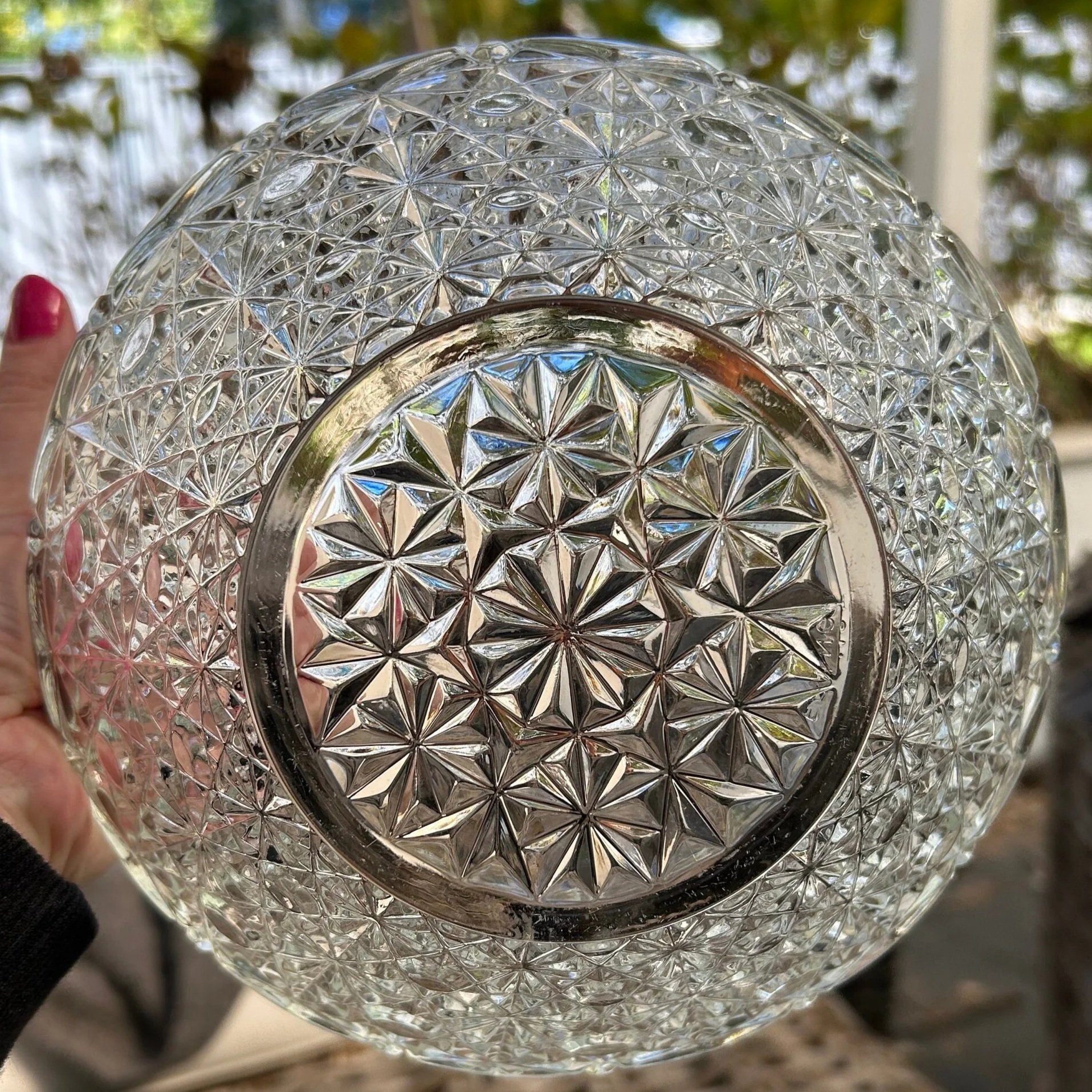 Base of bowl with embossed “FRANCE” marking and floral starburst texture