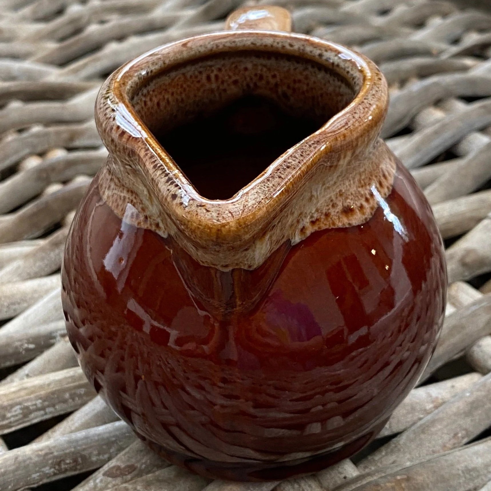 Angled spout view displaying depth and unique glaze texture